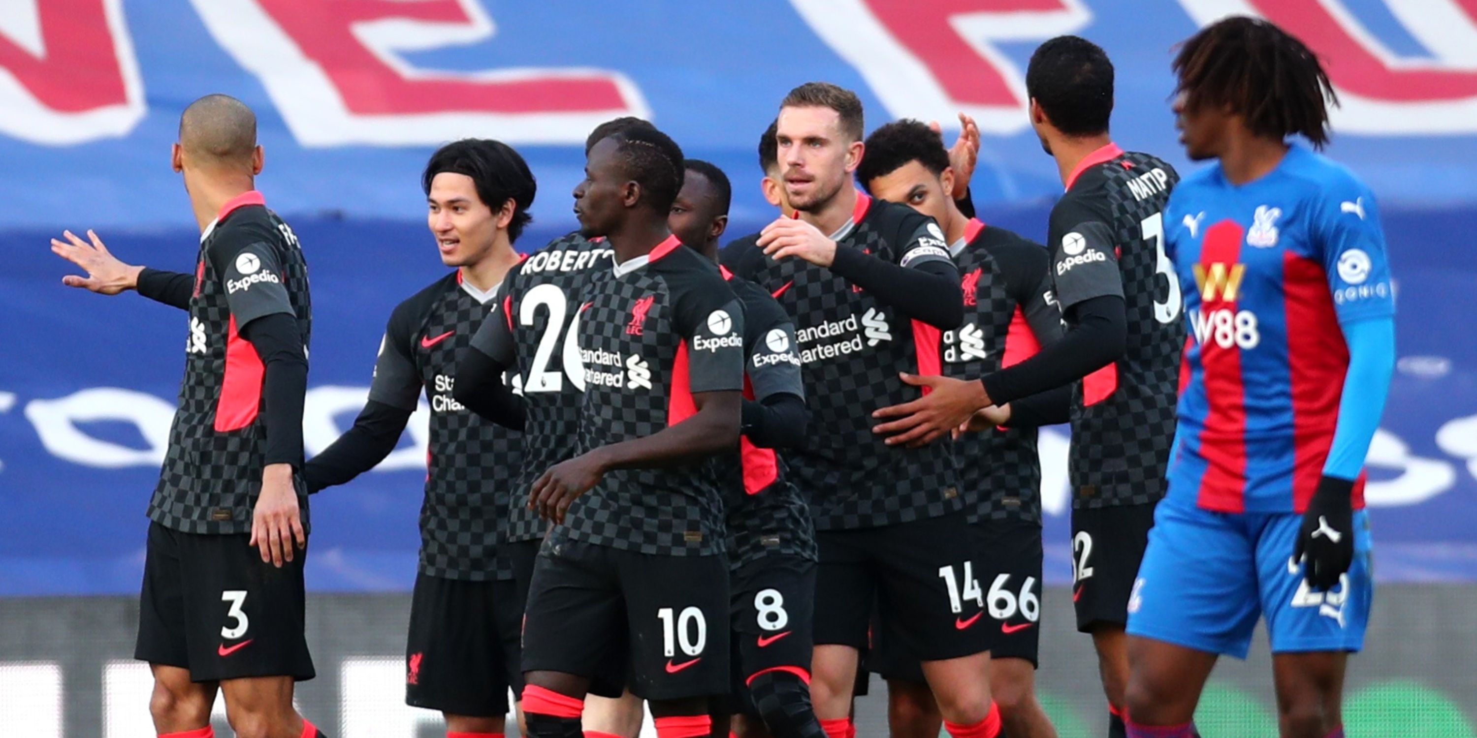 Liverpool players celebrate scoring against Crystal Palace. 