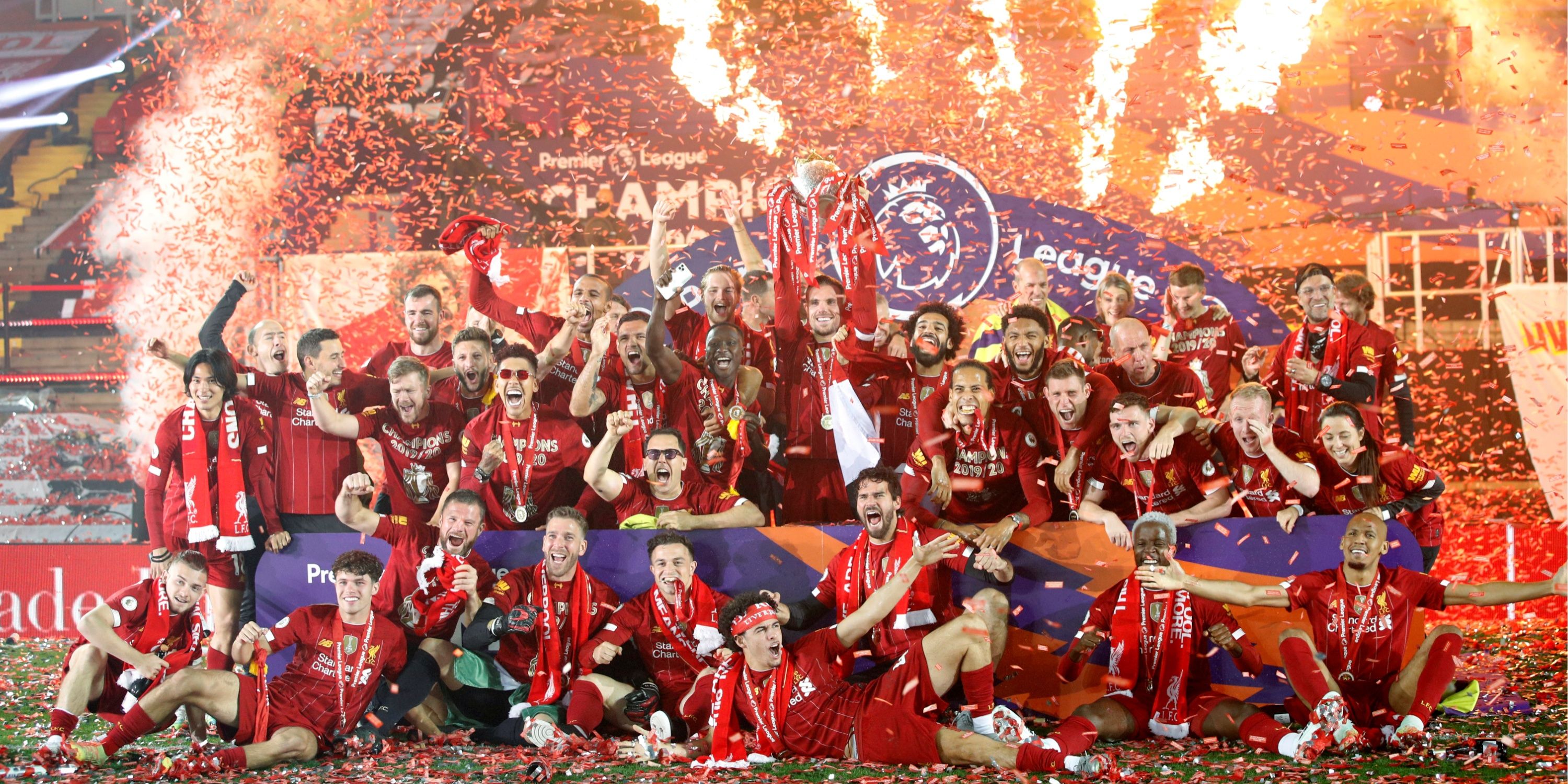 Liverpool players celebrate lifting the Premier League trophy. 