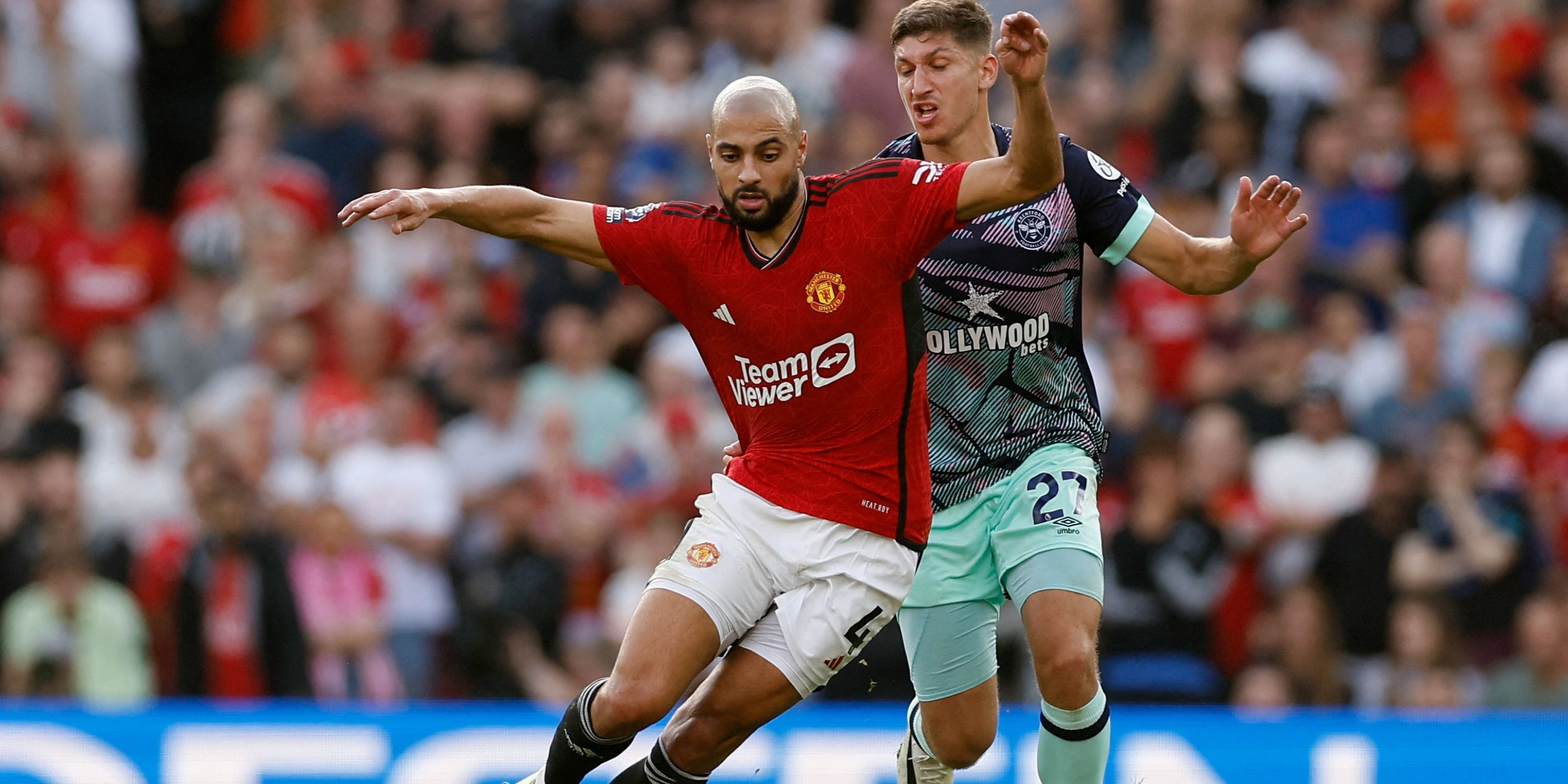 Manchester United midfielder Sofyan Amrabat in action with Brentford's Vitaly Janelt