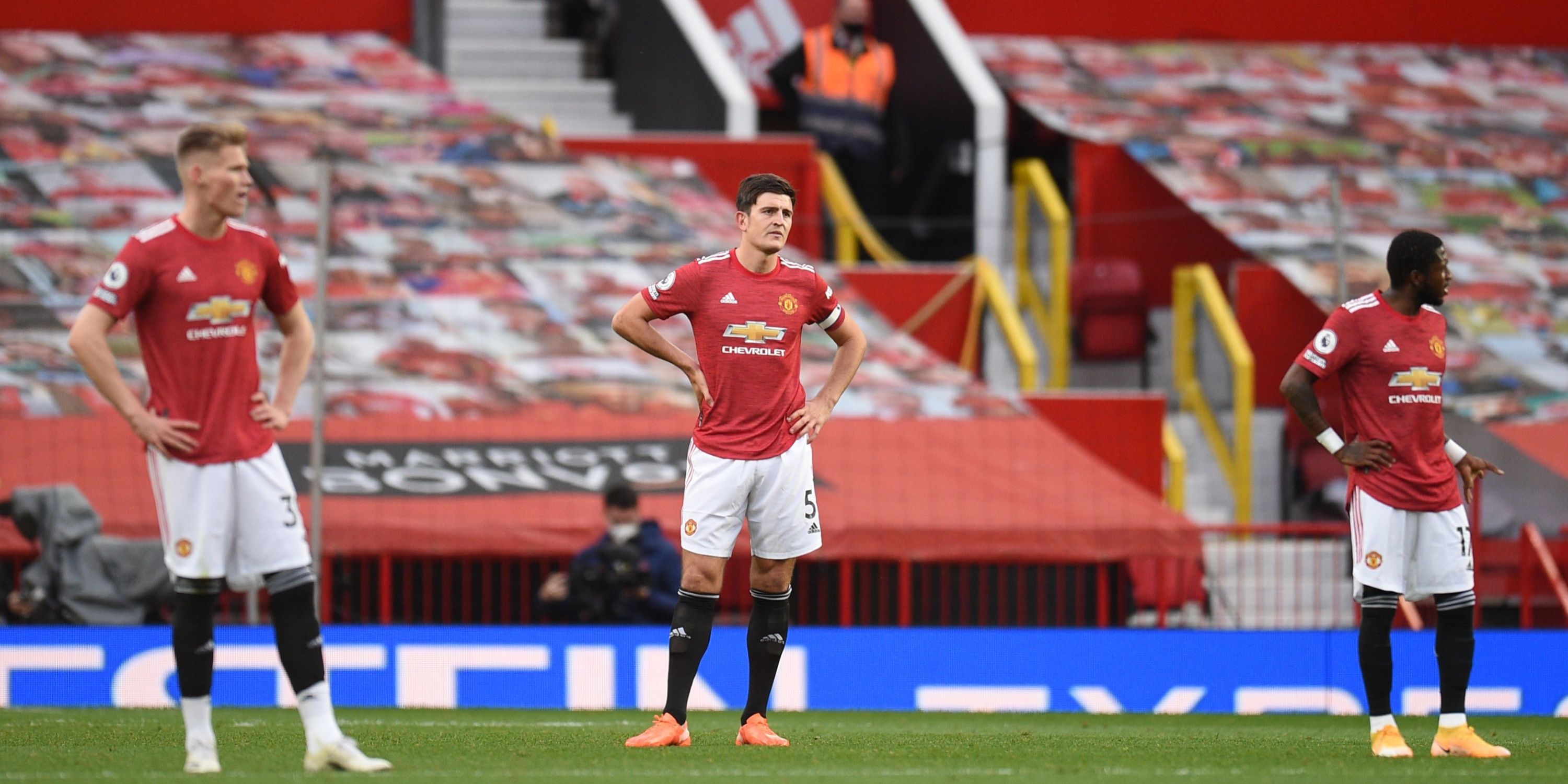 Manchester United trio Scott McTominay, Harry Maguire and Fred stand with their hands on their hips after conceding six against Tottenham.