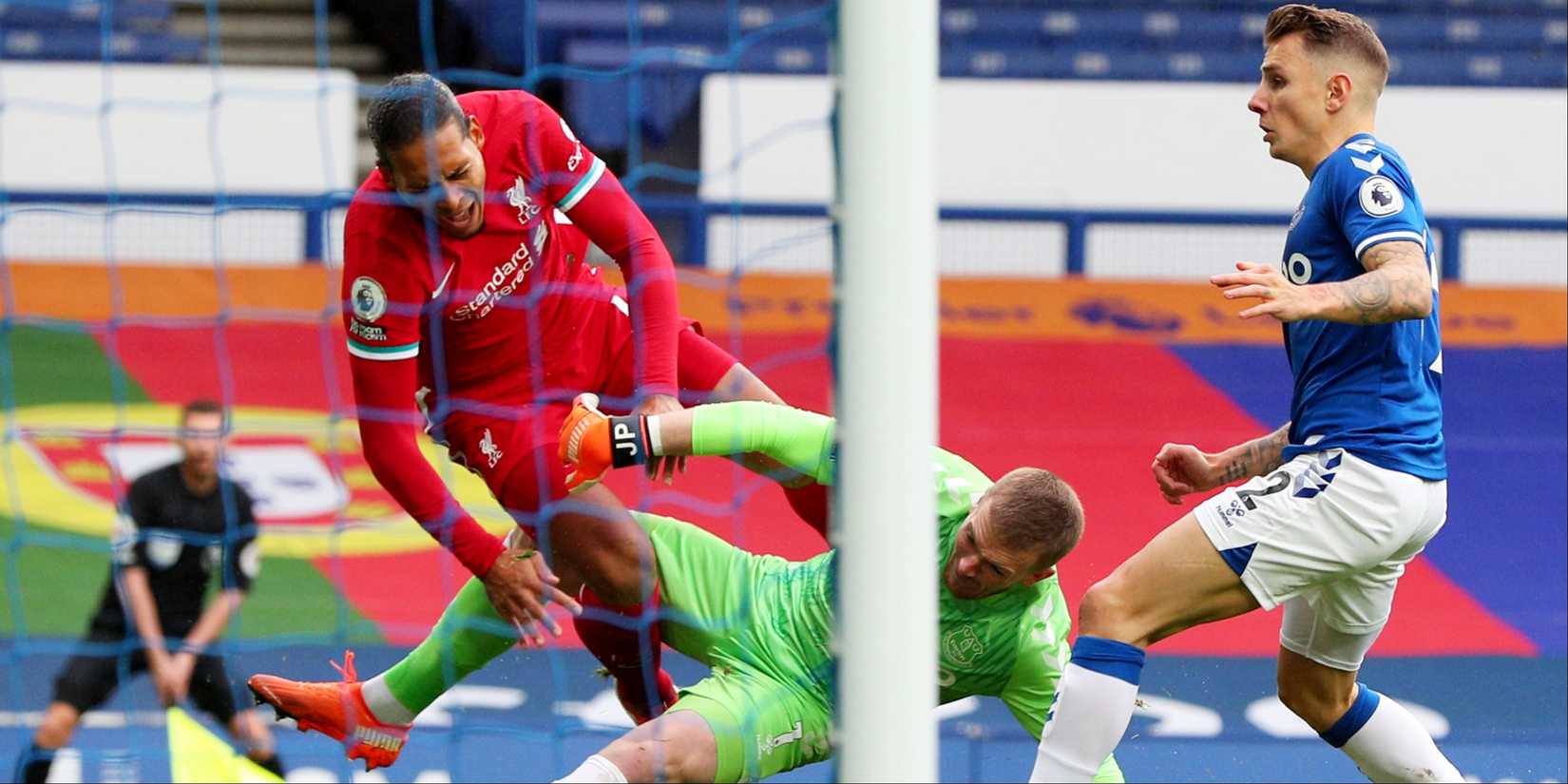 Liverpool's Virgil van Dijk collides with Everton's Jordan Pickford