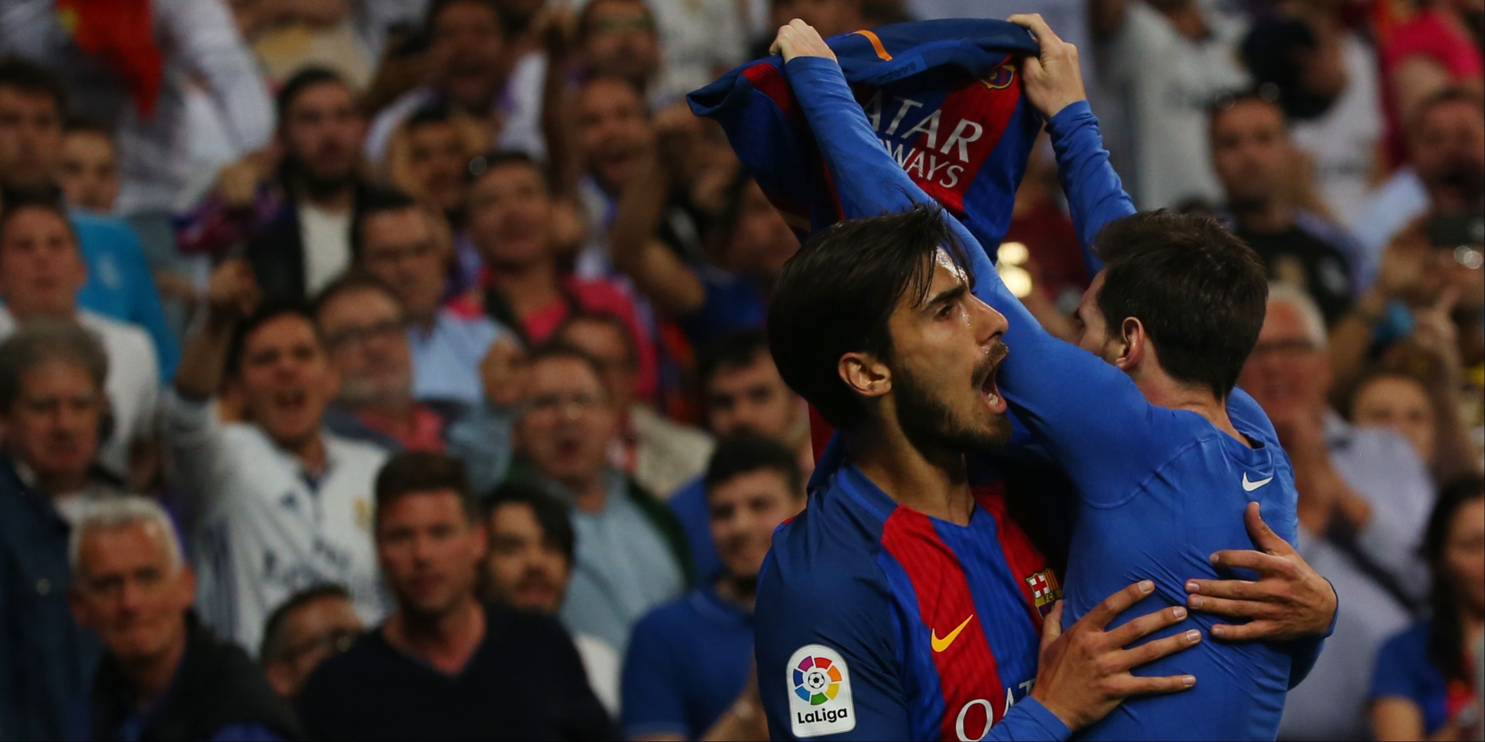 Barcelona's Lionel Messi celebrates with Andre Gomes