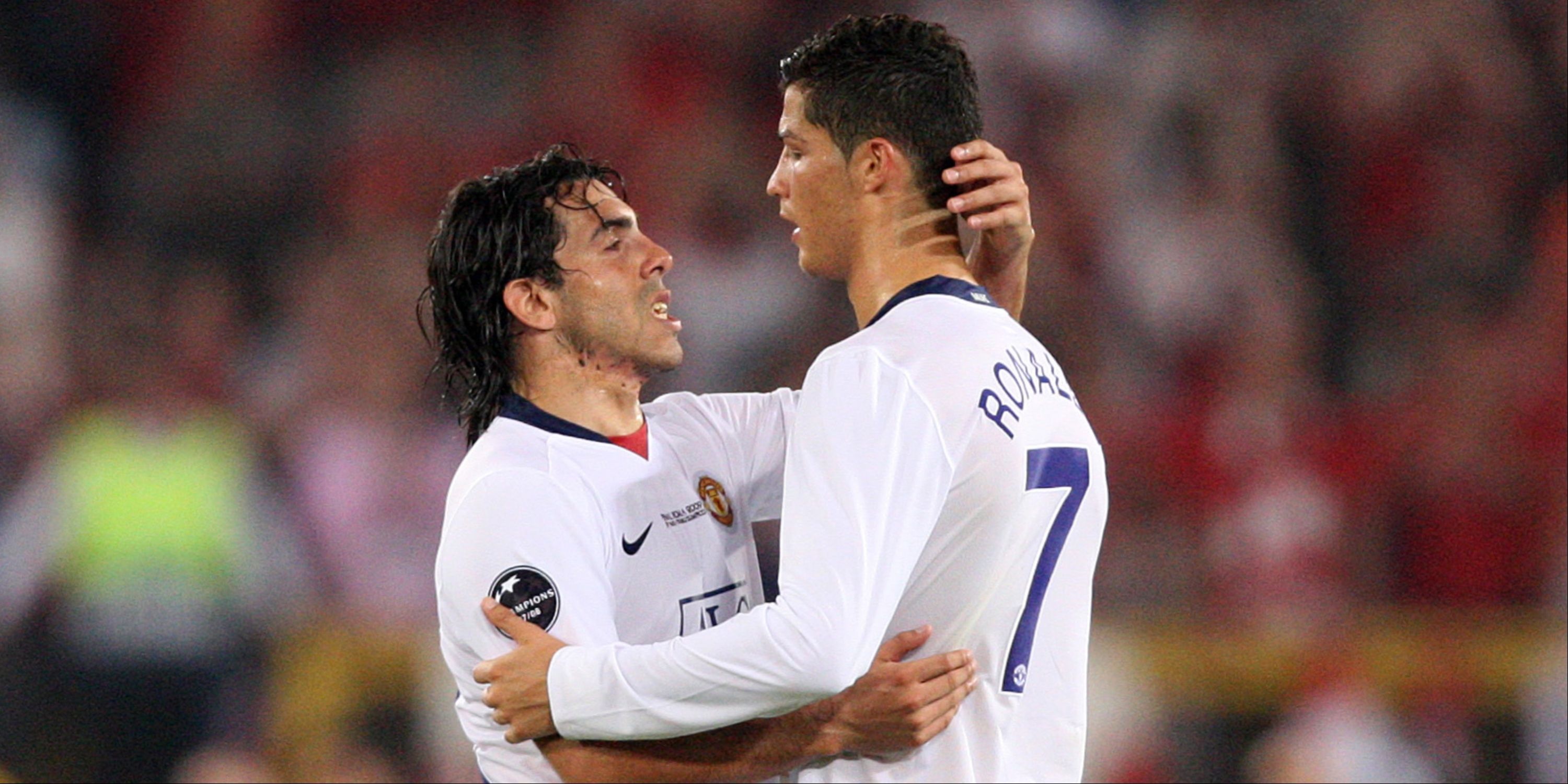 Manchester United's Cristiano Ronaldo (R) and Carlos Tevez