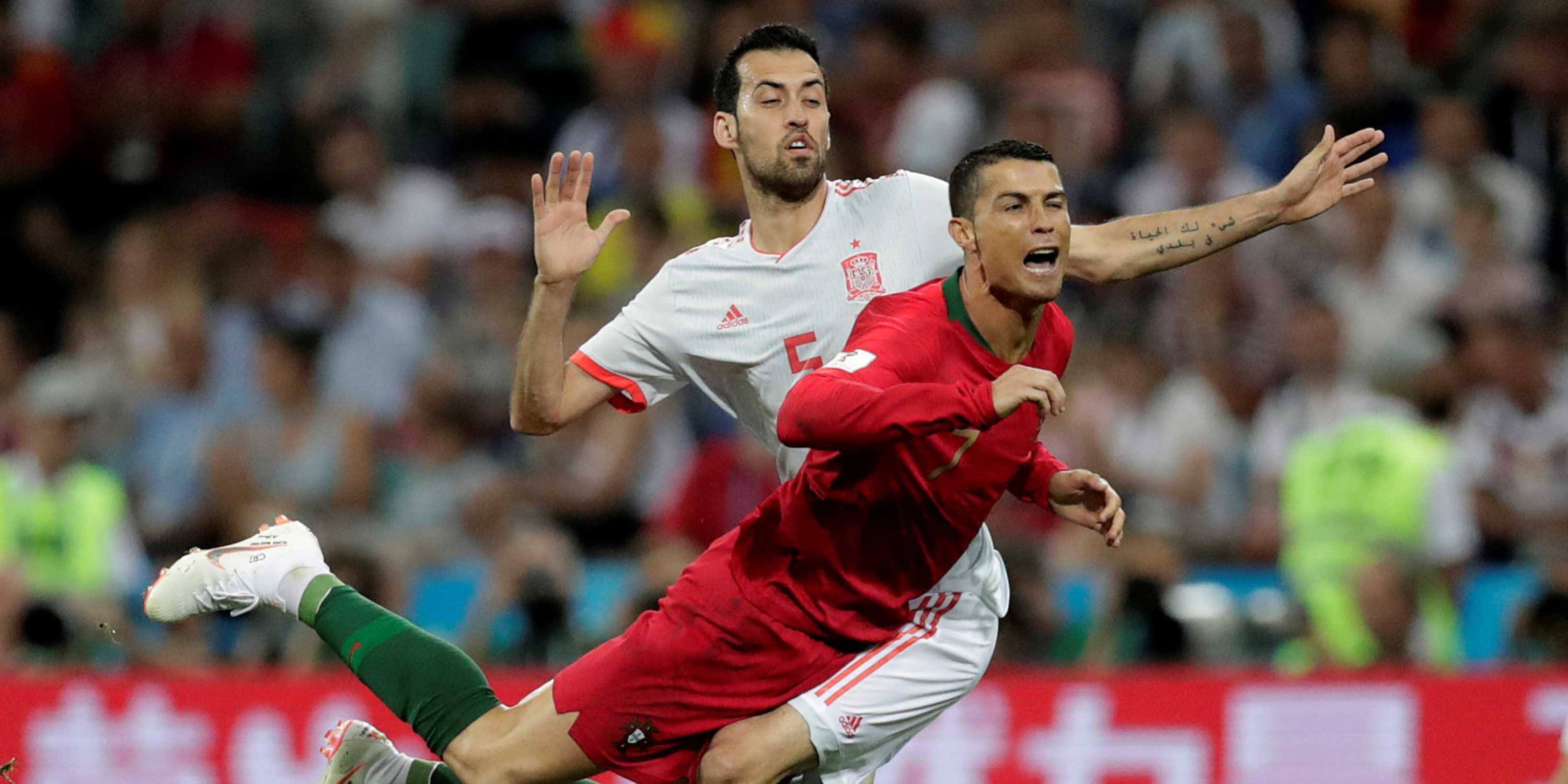 Portugal's Cristiano Ronaldo in action with Spain's Sergio Busquets