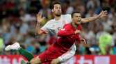 Portugal's Cristiano Ronaldo in action with Spain's Sergio Busquets