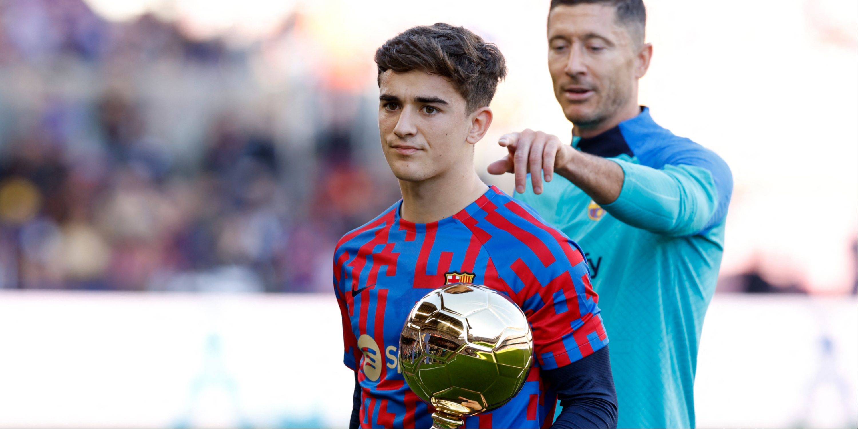 FC Barcelona' Gavi poses with the Golden Boy trophy