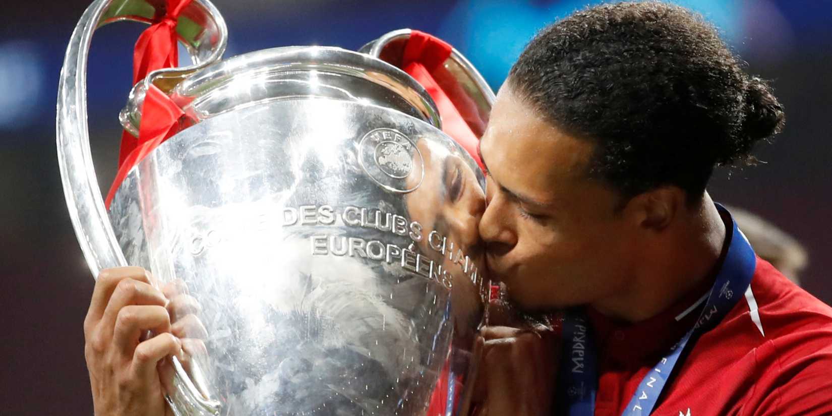 Virgil van Dijk kisses the Champions League trophy