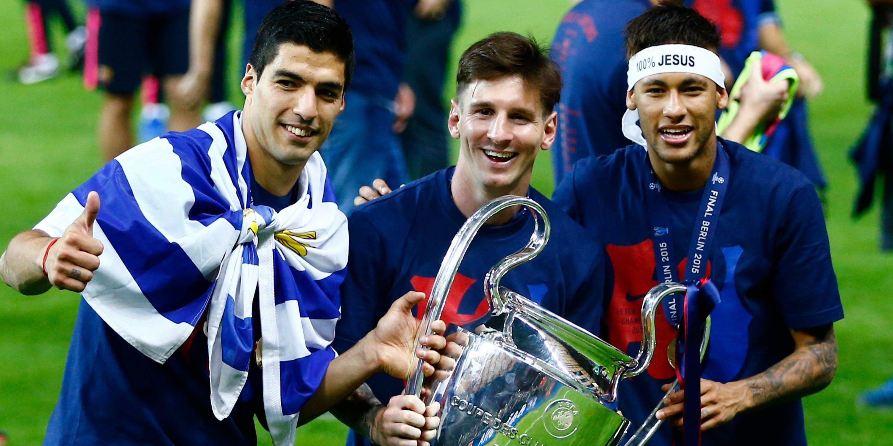 Barcelona's Luis Suarez, Lionel Messi and Neymar celebrate with the trophy after winning the UEFA Champions League