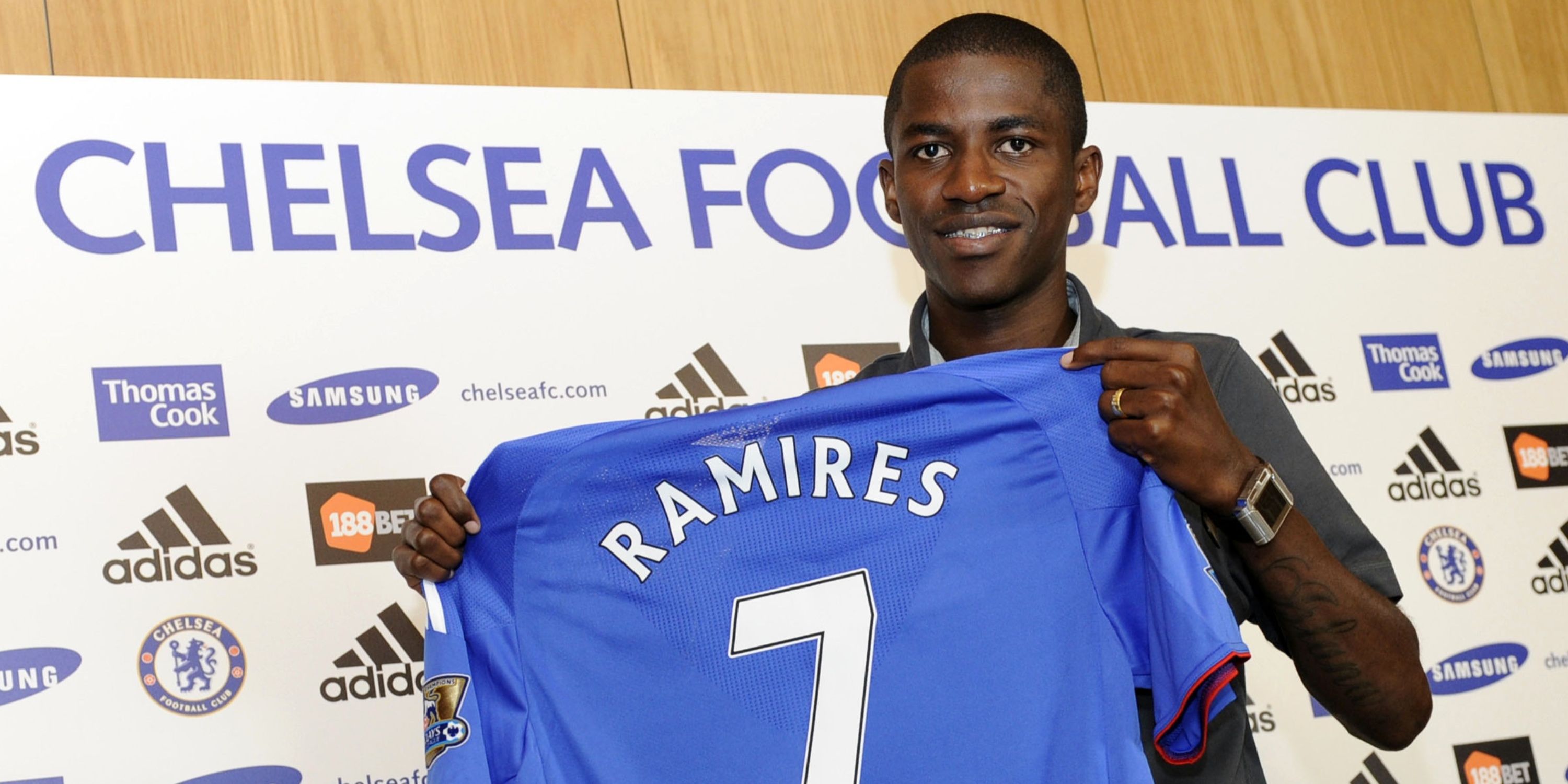 New signing Ramires holds aloft a Chelsea shirt. 