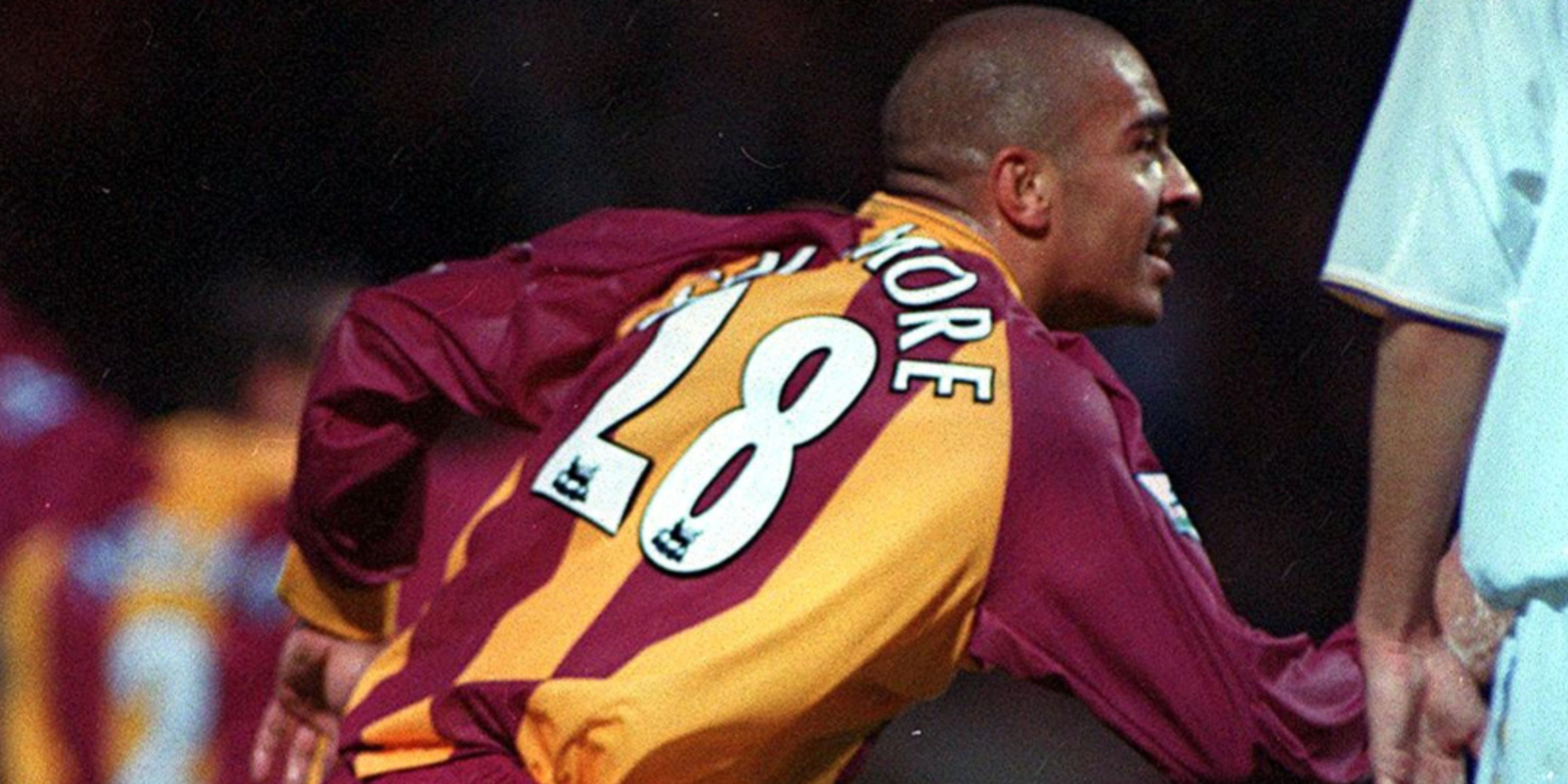 Stan Collymore celebrates scoring for Bradford City. 