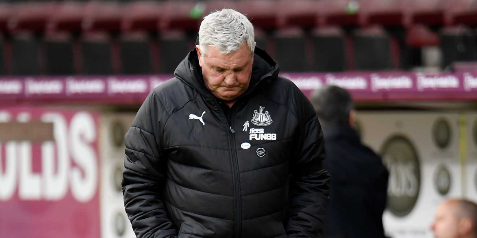 Steve Bruce looks on