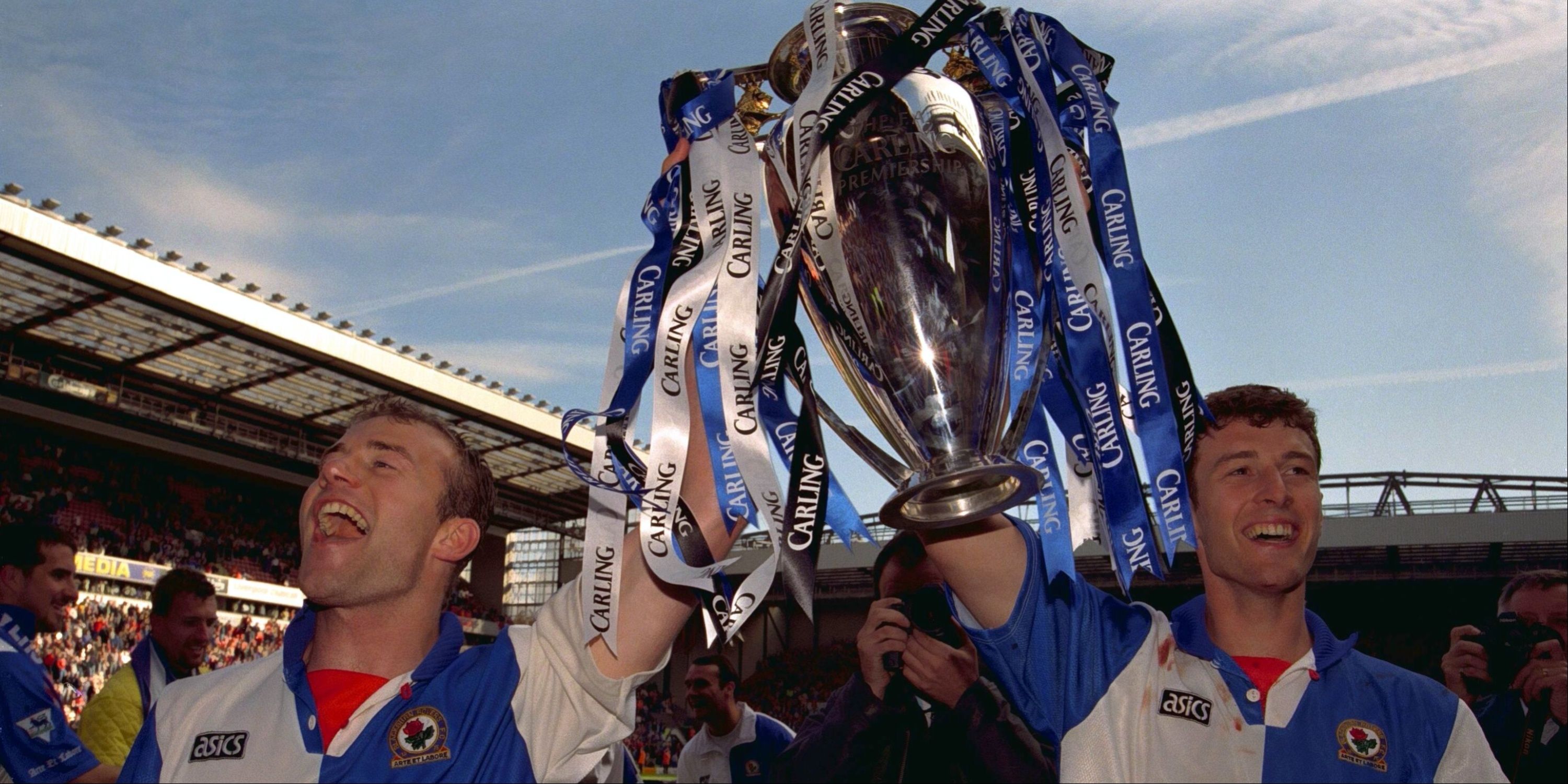 Blackburn Rovers players Alan Shearer and Chris Sutton lift the Premier League trophy.