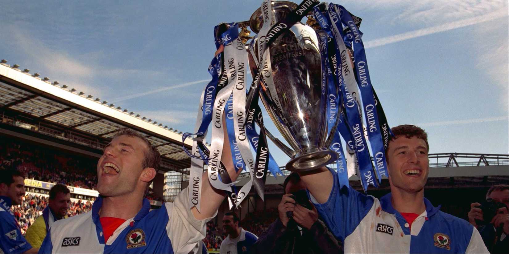 Blackburn Rovers players Alan Shearer and Chris Sutton lift the Premier League trophy.