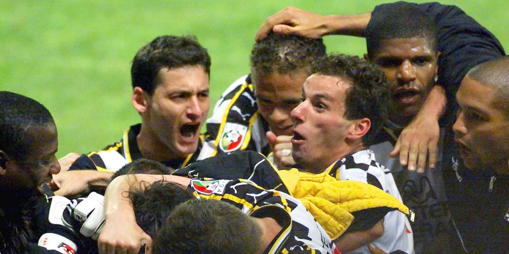 Boavista players celebrate a goal.