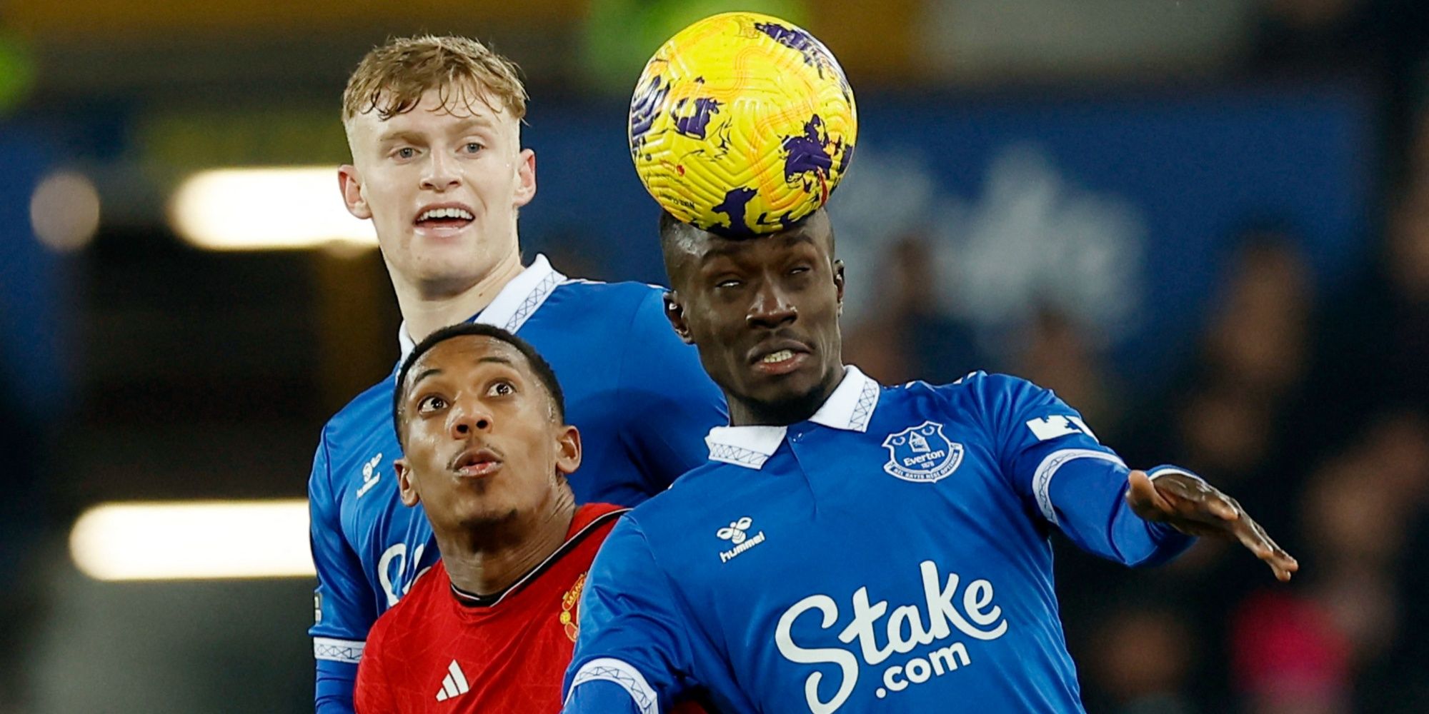 Manchester United's Anthony Martial in action with Everton's Jarrad Branthwaite and Idrissa Gueye