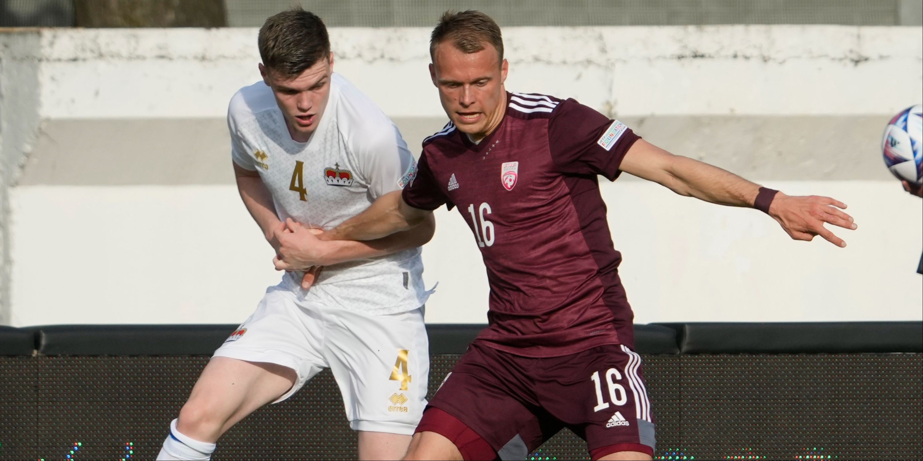 Latvia's Alvis Jaunzems in action with Liechtenstein's Andrin Netzer