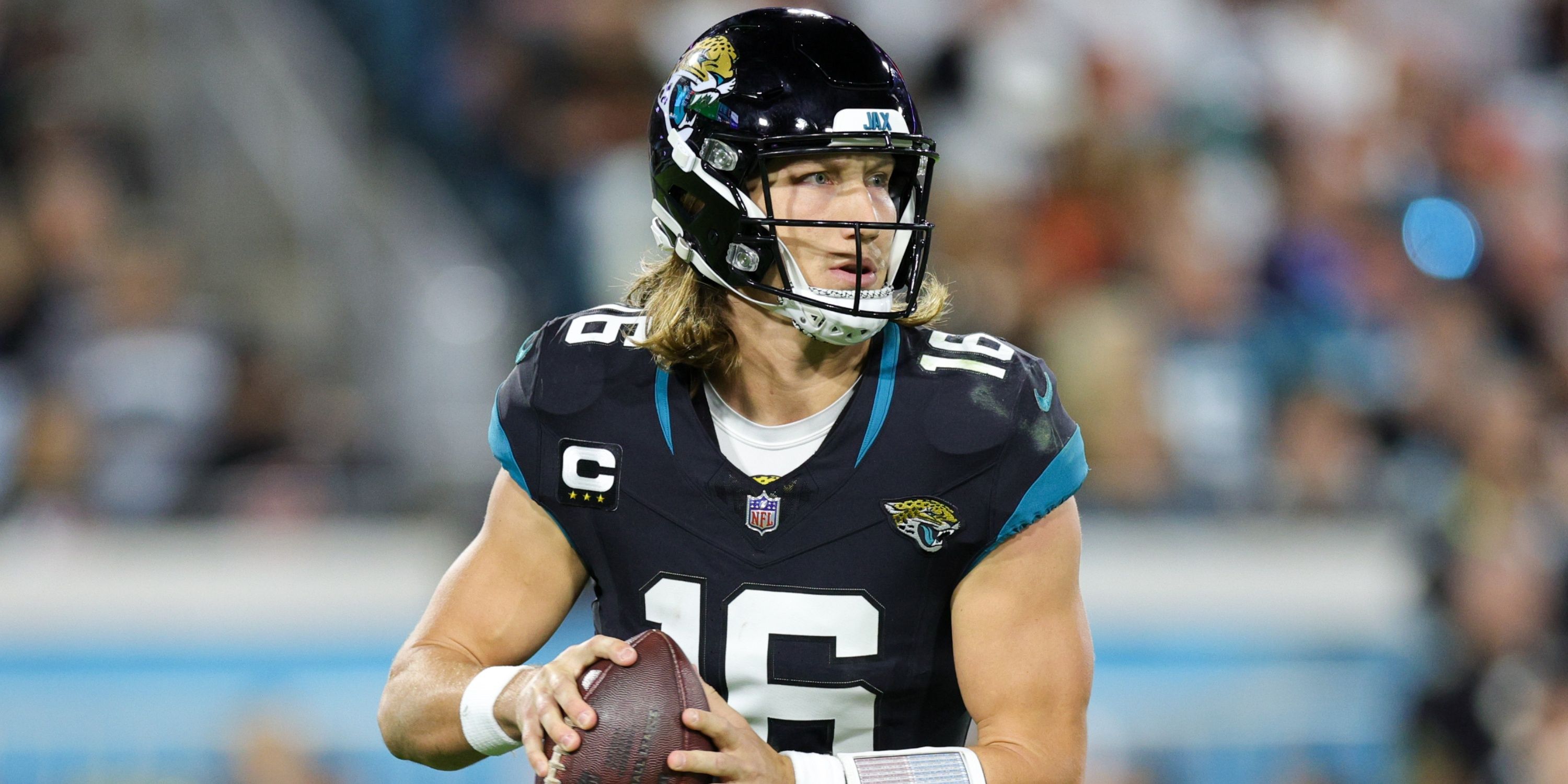 Trevor Lawrence drops back to pass 