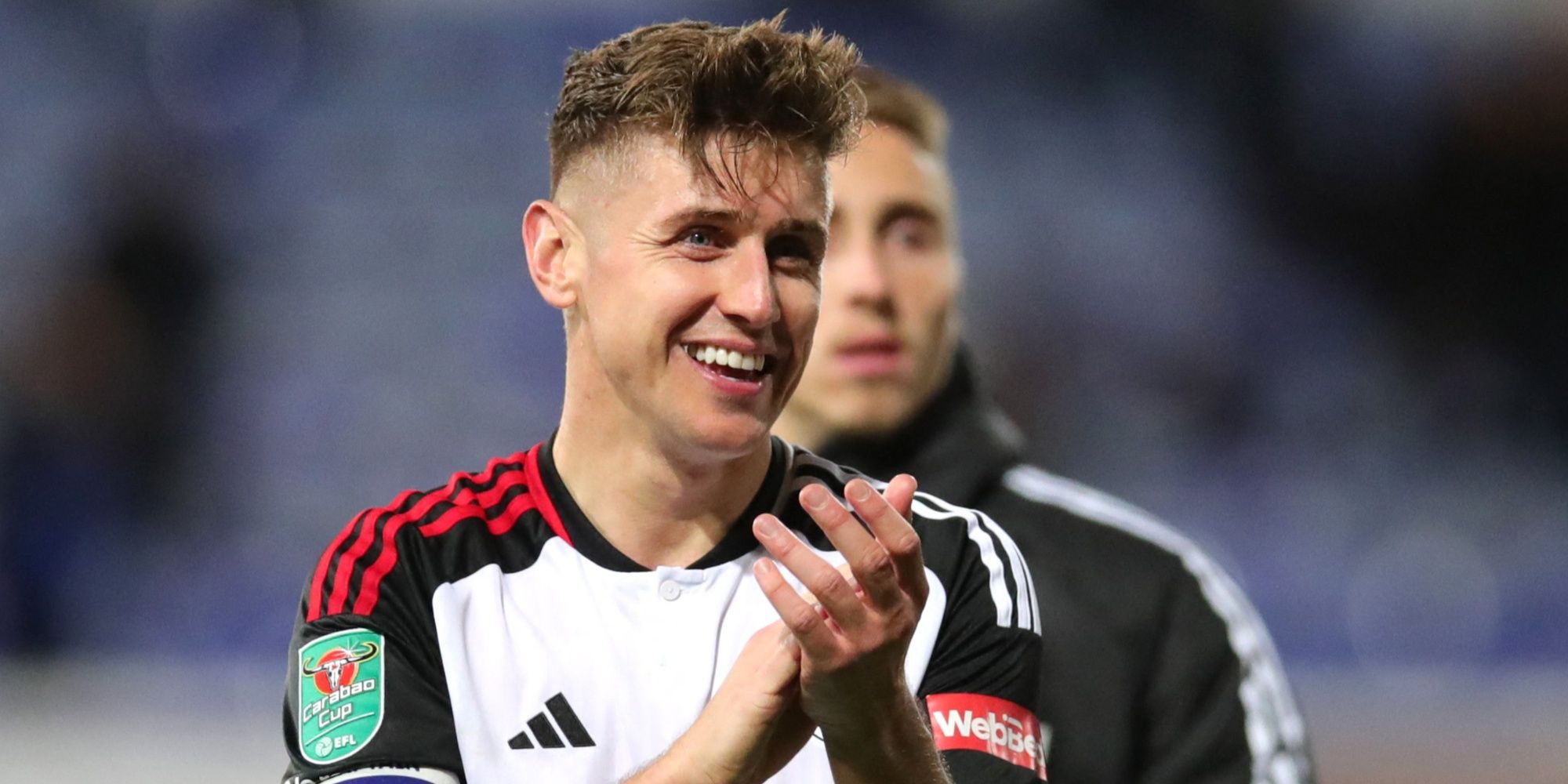 Tom Cairney of Fulham applauds