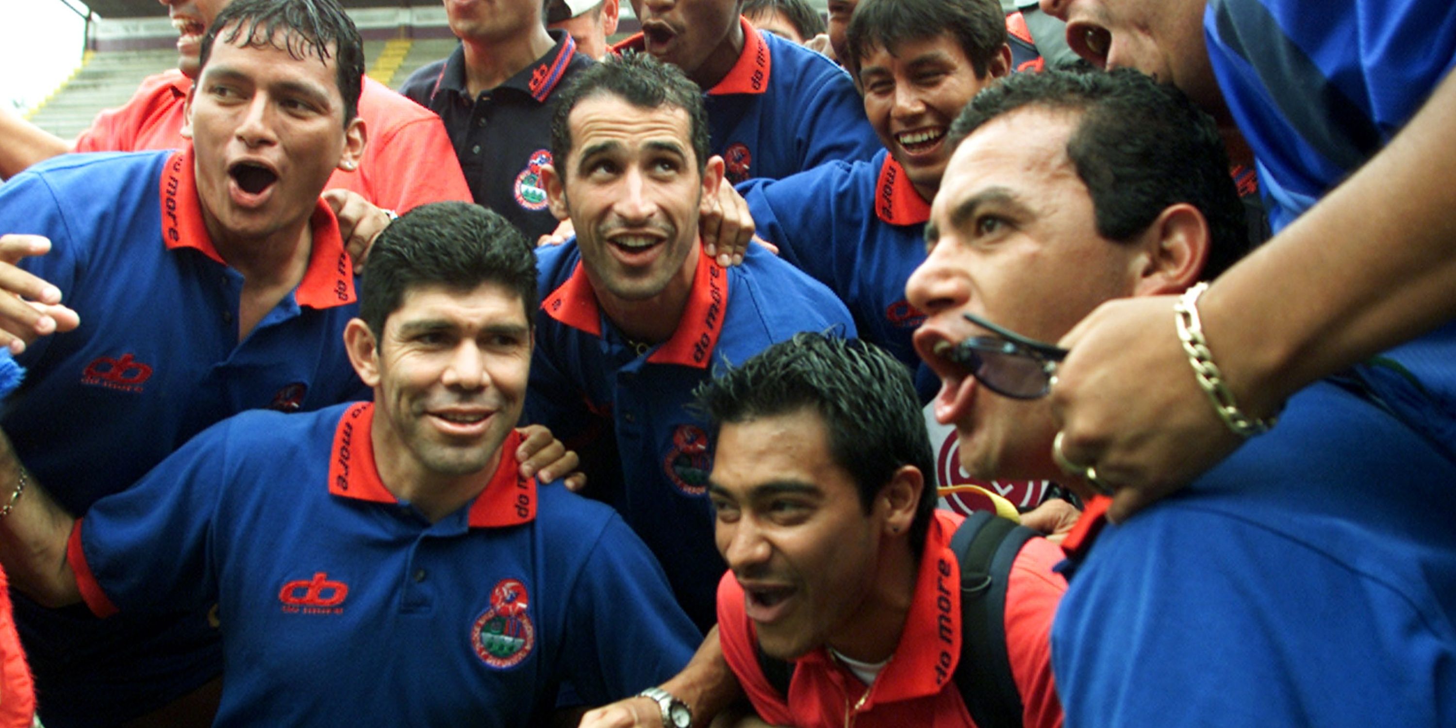 Guatemalan players from Municipal celebrate next to the trophy of the Central America Championship of Clubs