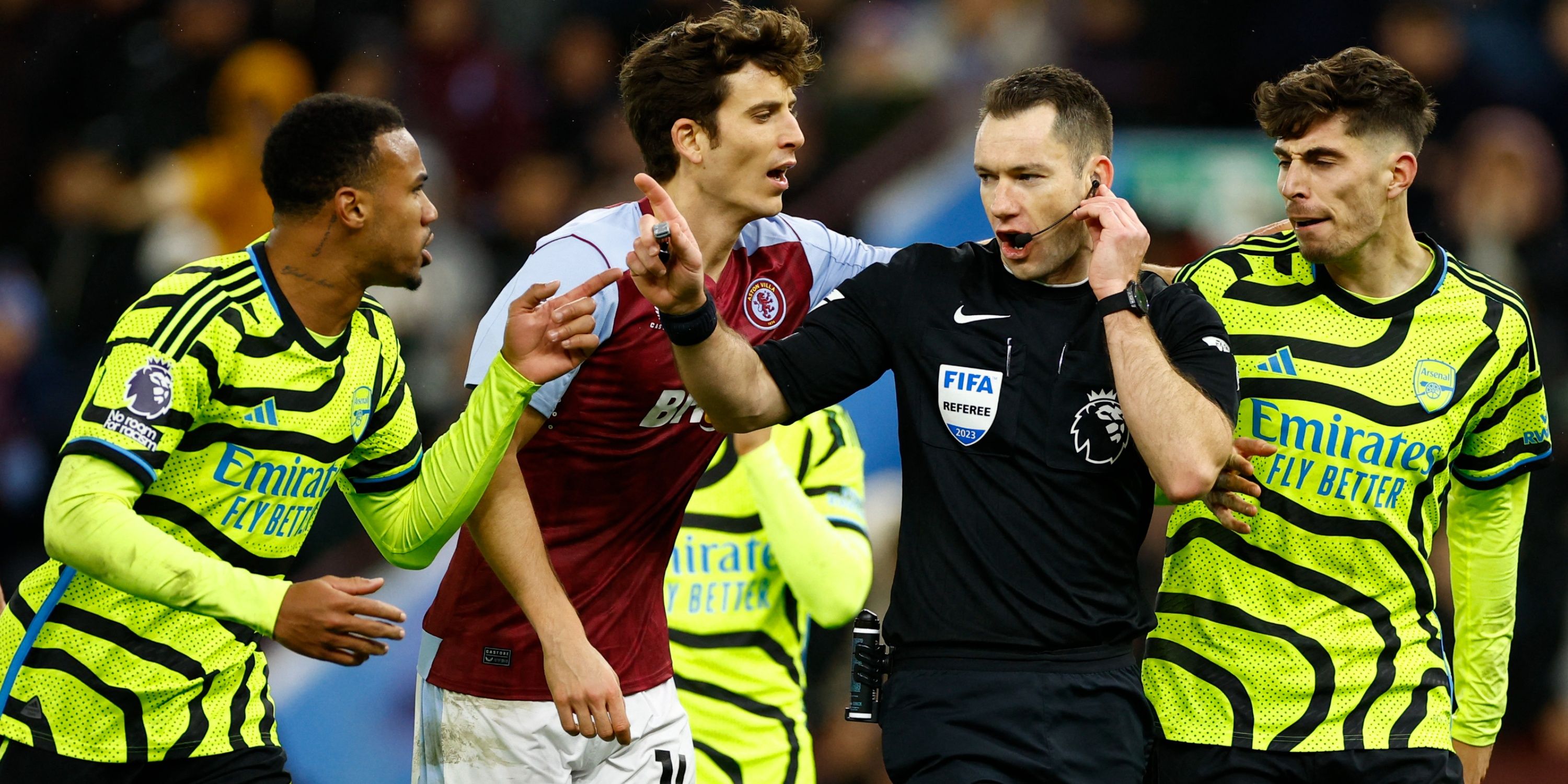 Arsenal's Gabriel and Kai Havertz remonstrate with the referee Jarred Gillett and Aston Villa's Pau Torres