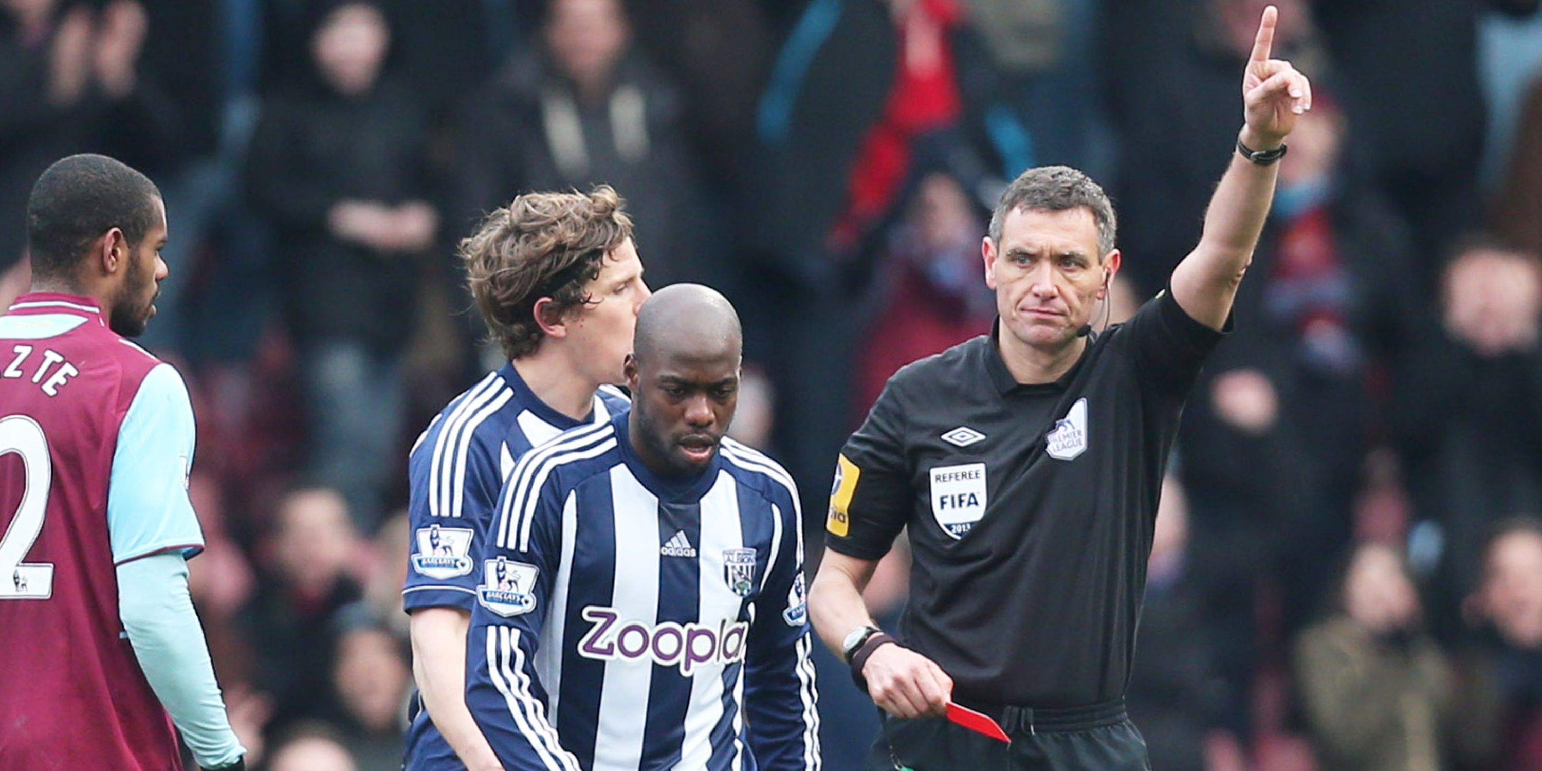 West Bromwich's Youssouf Mulumbu (C) is shown a red card by referee Andre Marriner