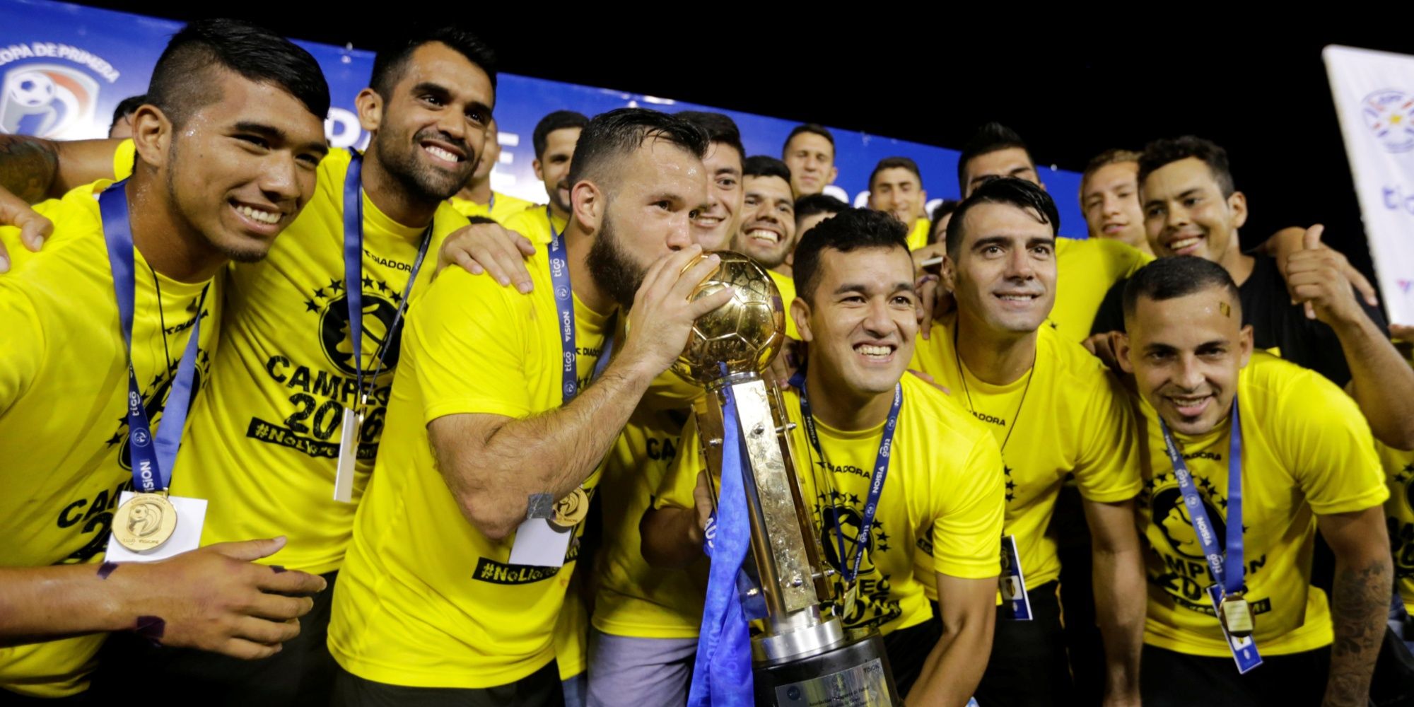 Guarani's players lift the trophy after winning the championship