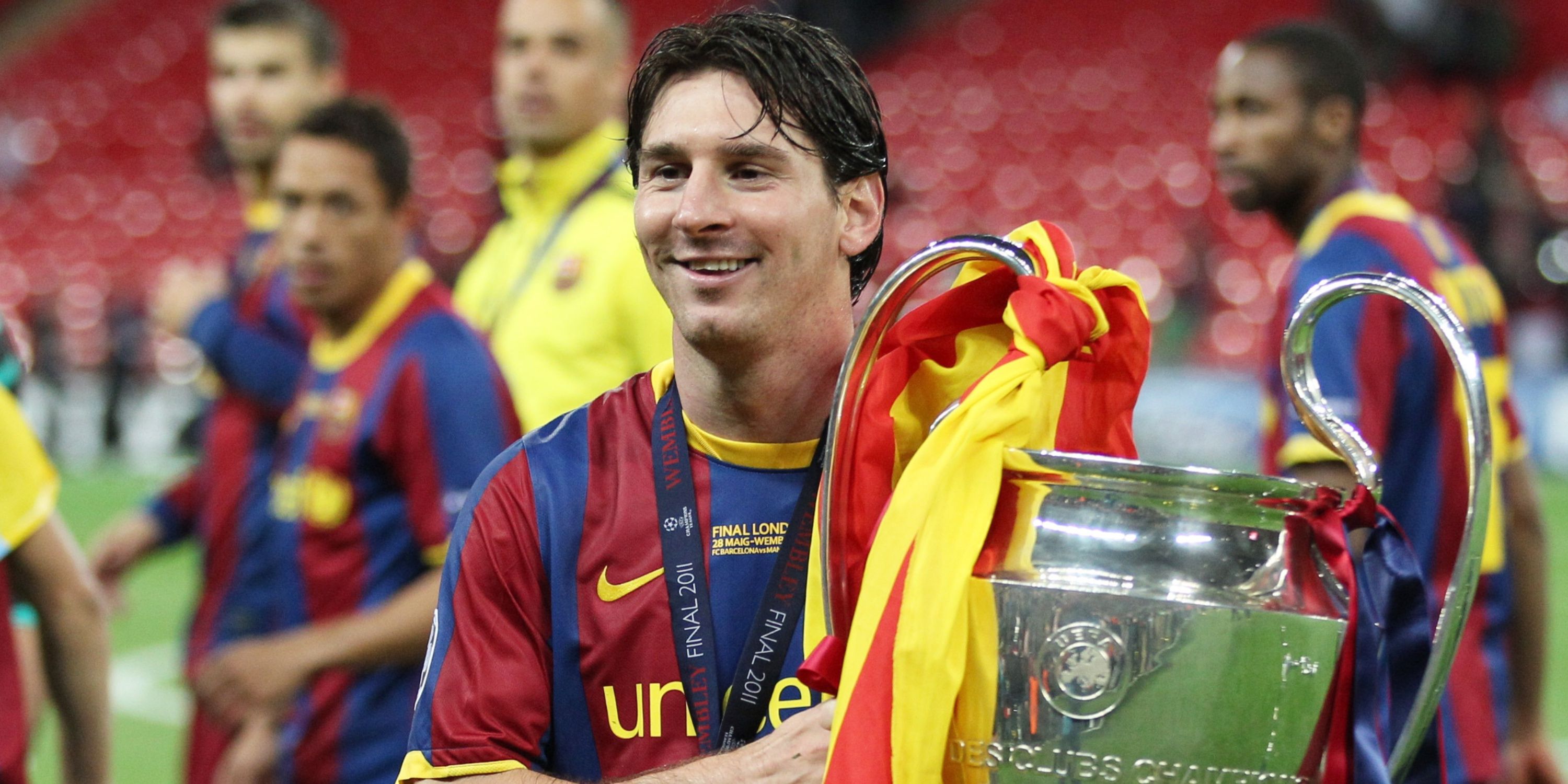 Lionel Messi with the Champions League trophy in 2011