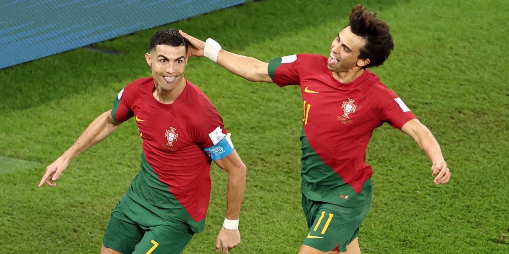 Cristiano Ronaldo celebrates scoring a goal with Joao Felix