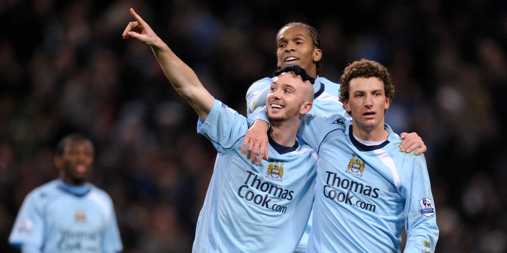 Manchester City's Stephen Ireland and Elanno Jo celebrate.