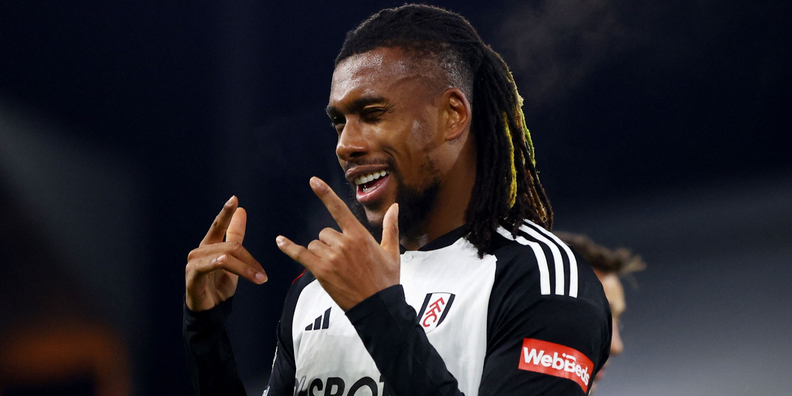 Alex Iwobi celebrates a goal for Fulham