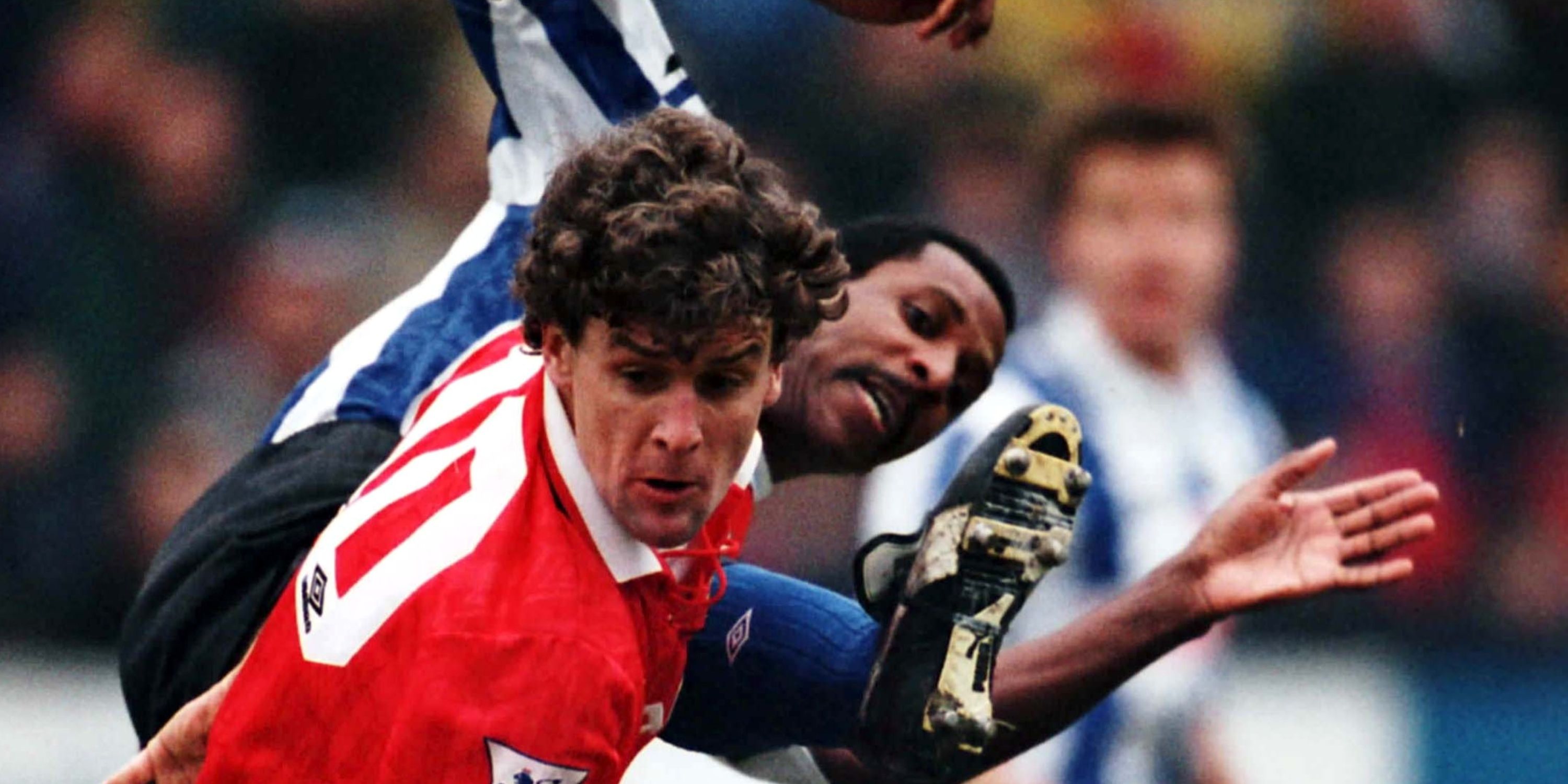 Manchester United's Mark Hughes in action with Sheffield Wednesday's Viv Anderson.