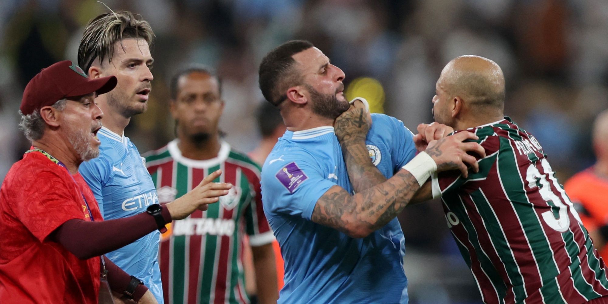 Manchester City's Kyle Walker clashes with Fluminense's Felipe Melo 