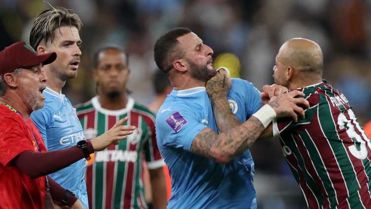 Manchester City's Kyle Walker clashes with Fluminense's Felipe Melo 