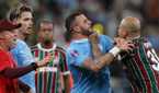 Manchester City's Kyle Walker clashes with Fluminense's Felipe Melo 