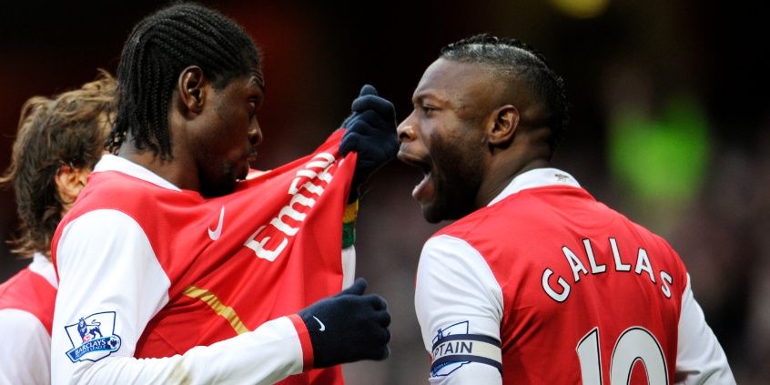 Emmanuel Adebayor celebrates scoring the first goal for Arsenal with William Gallas