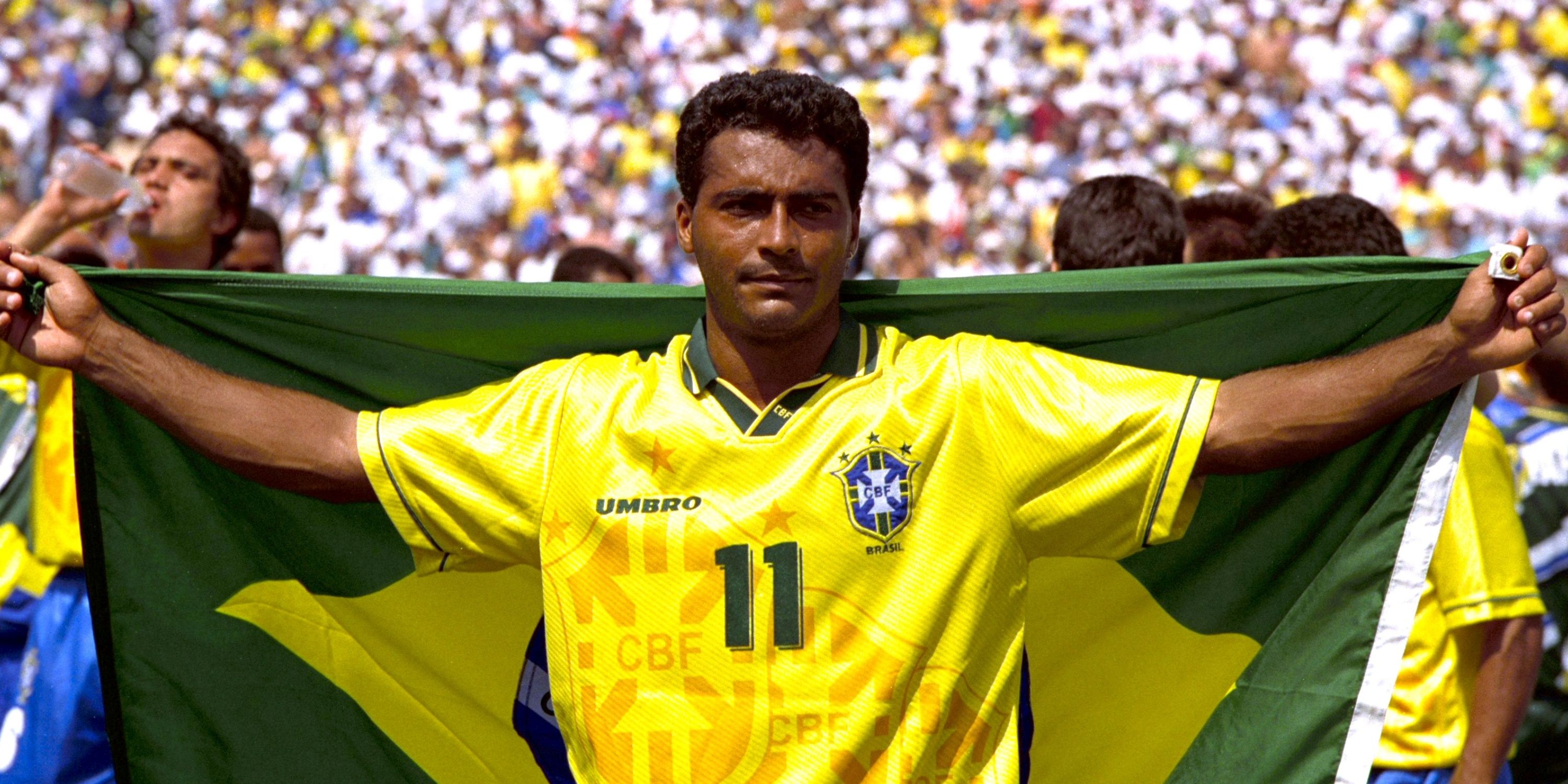 Brazil's Romario holding a Brazilian flag.