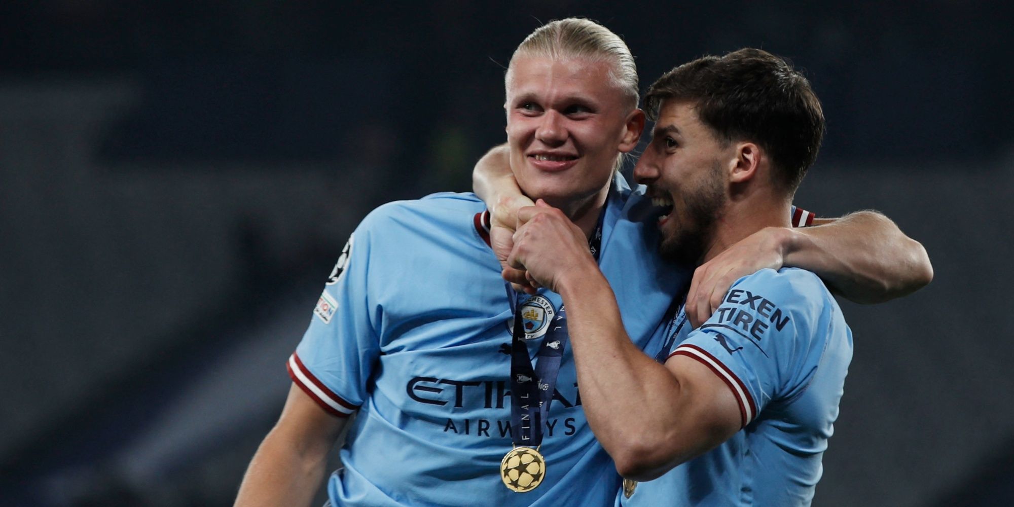 Man City's Erling Haaland and Ruben Dias celebrate after winning the Champions League.