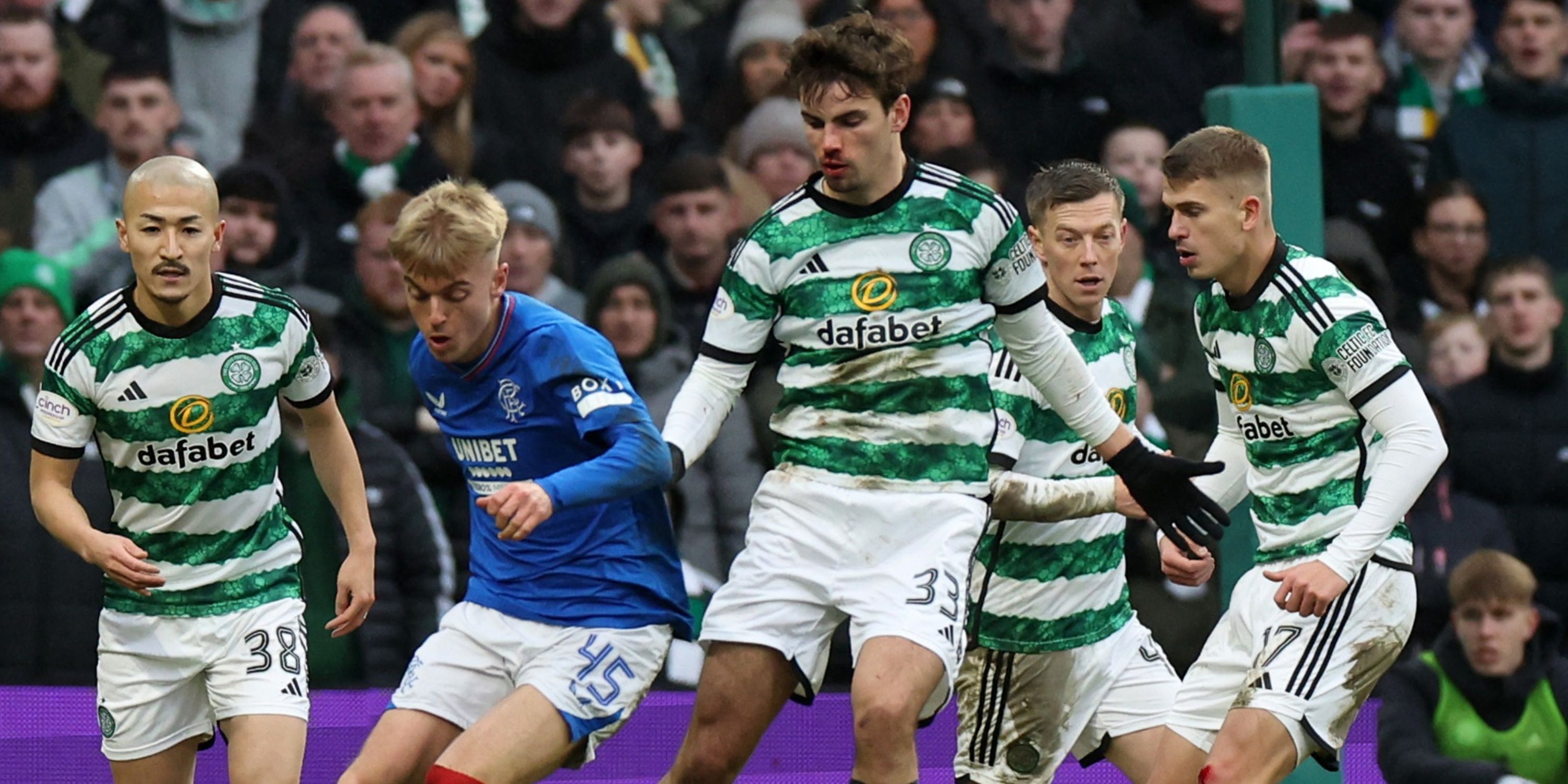 Celtic midfielder Matt O'Riley battling for possession