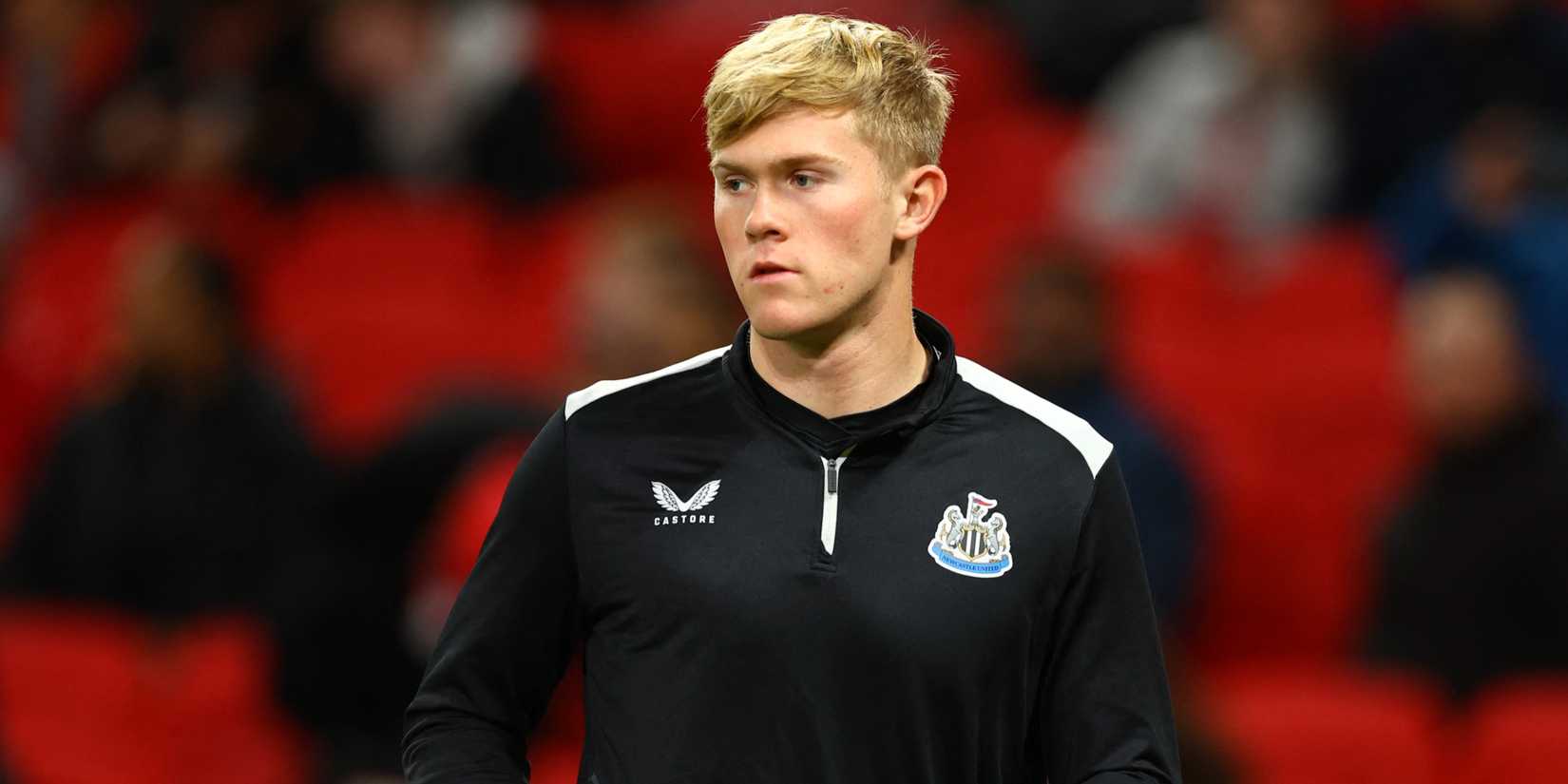 Newcastle United left-back Lewis Hall during a pre-match warm-up