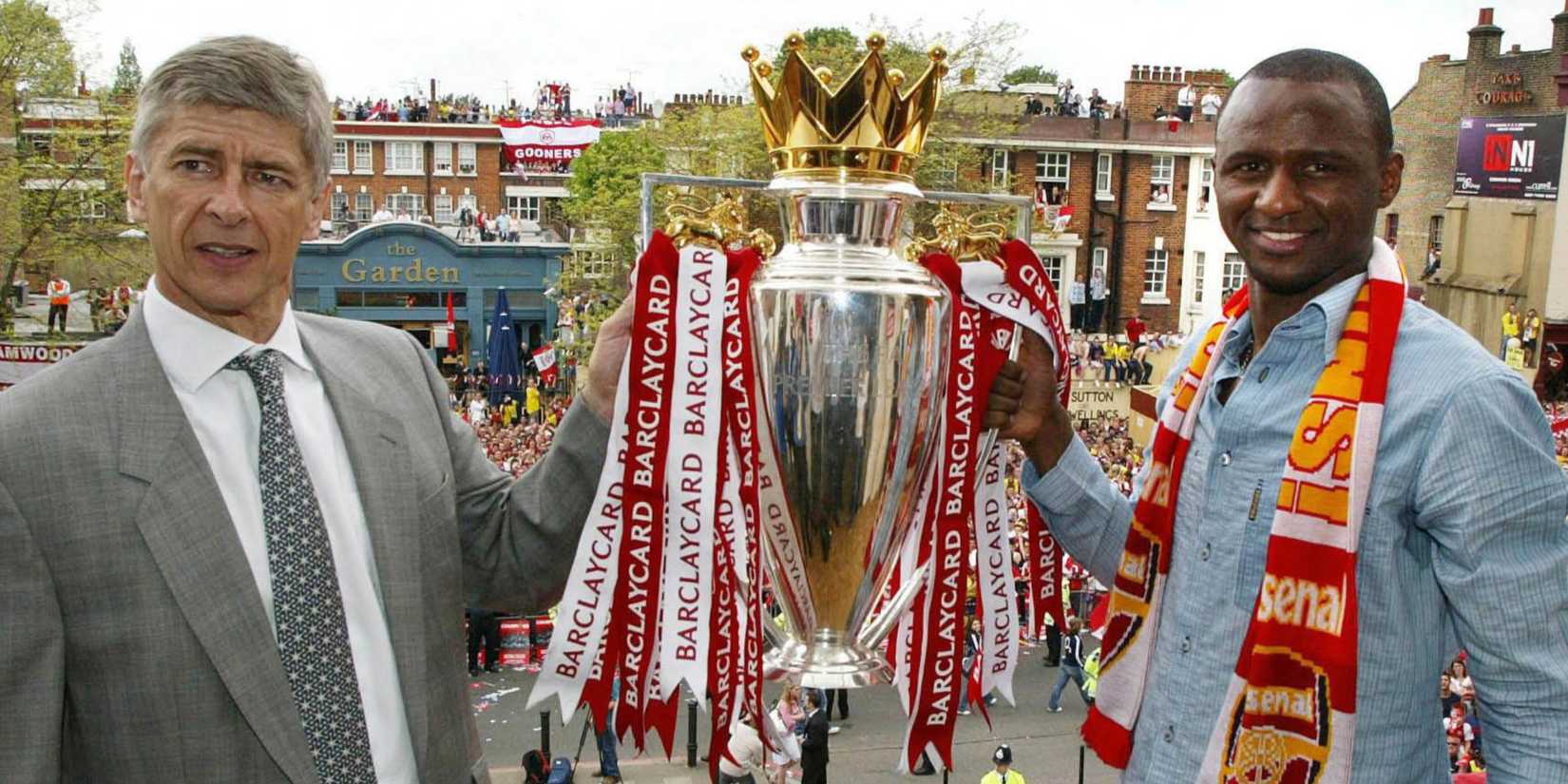 Arsenal's manager Arsene Wenger and captain Patrick Vieira hold up the Premier League trophy