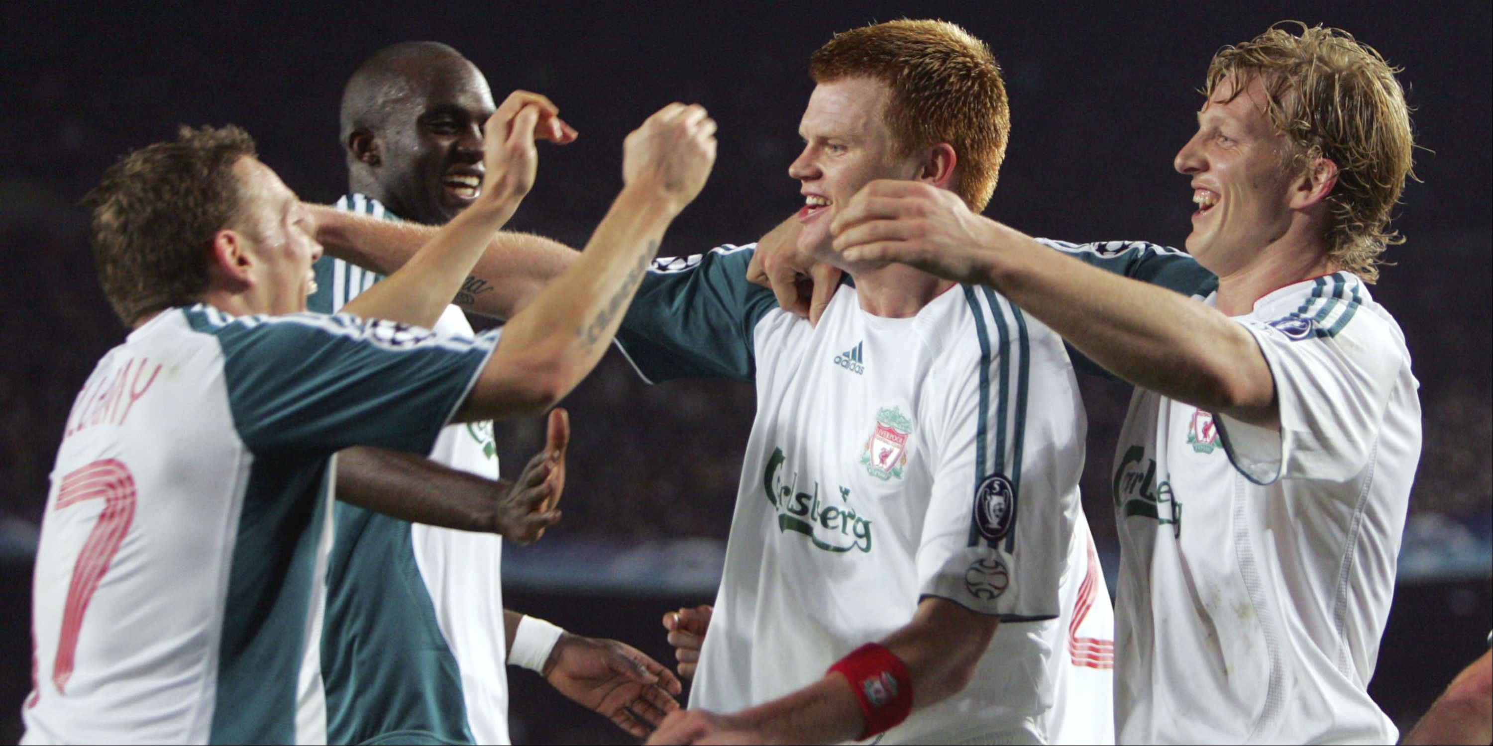 Liverpool teammates John Arne Riise and Craig Bellamy celebrate a goal against Barcelona.