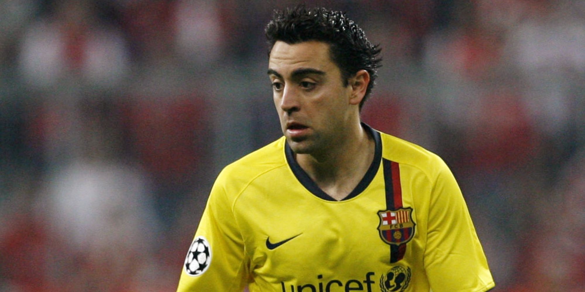 Xavi of Barcelona looks on