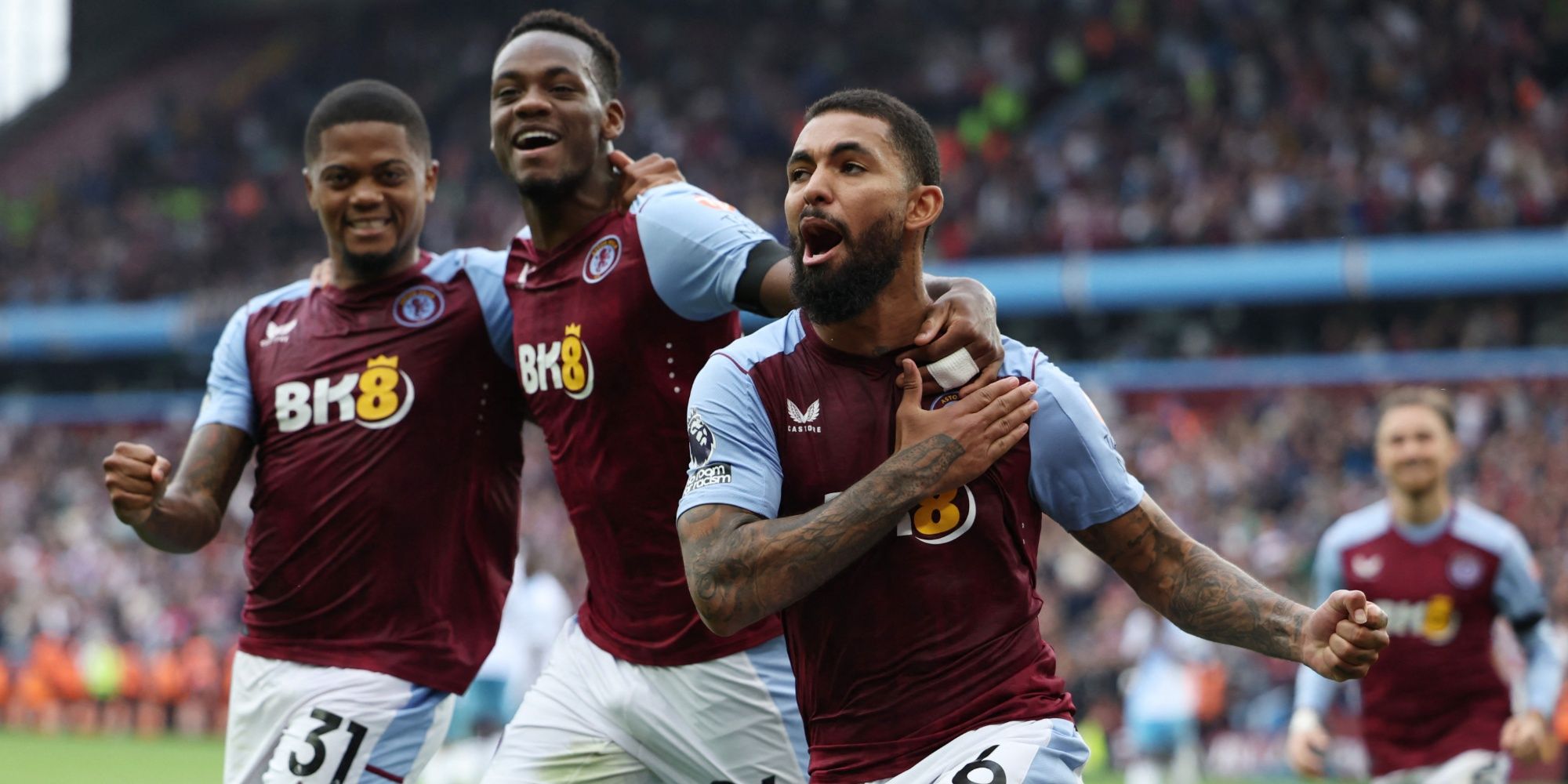 Aston Villa's Douglas Luiz celebrates scoring their winner with teammates
