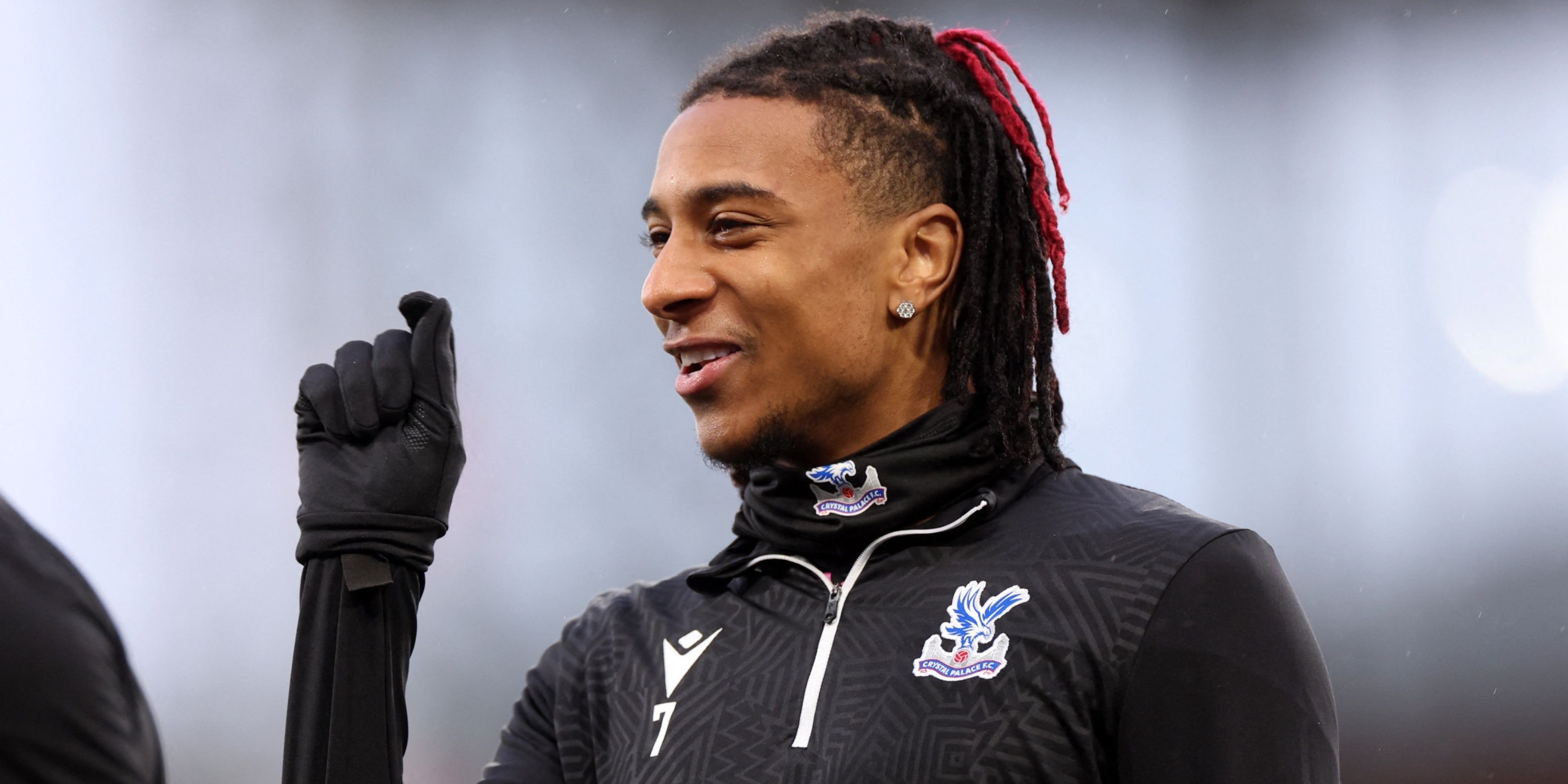 Crystal Palace winger Michael Olise warming up