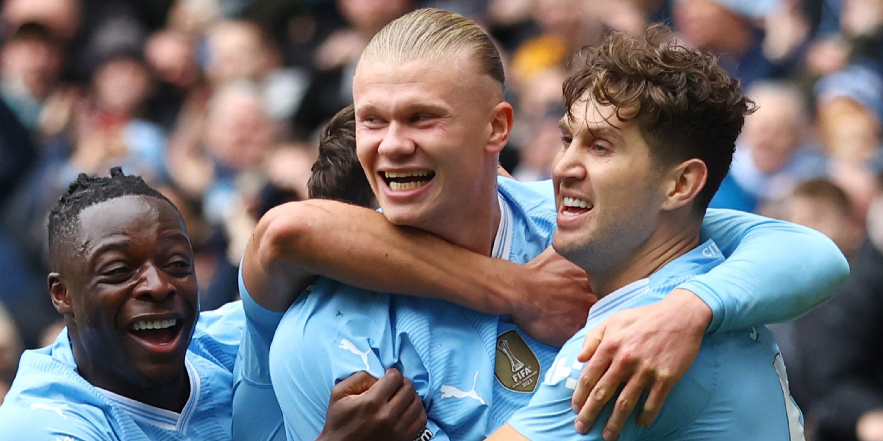 Manchester City's Erling Braut Haaland celebrates scoring their goal vs Everton with Jeremy Doku and John Stones