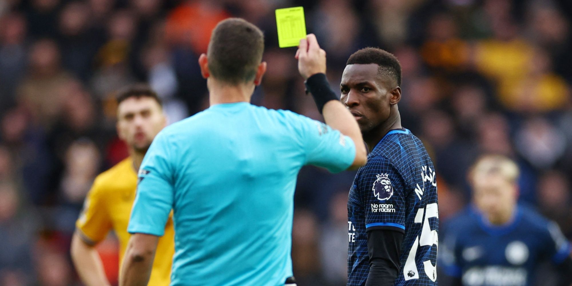 Chelsea's Nicolas Jackson is shown a yellow card against Wolves.