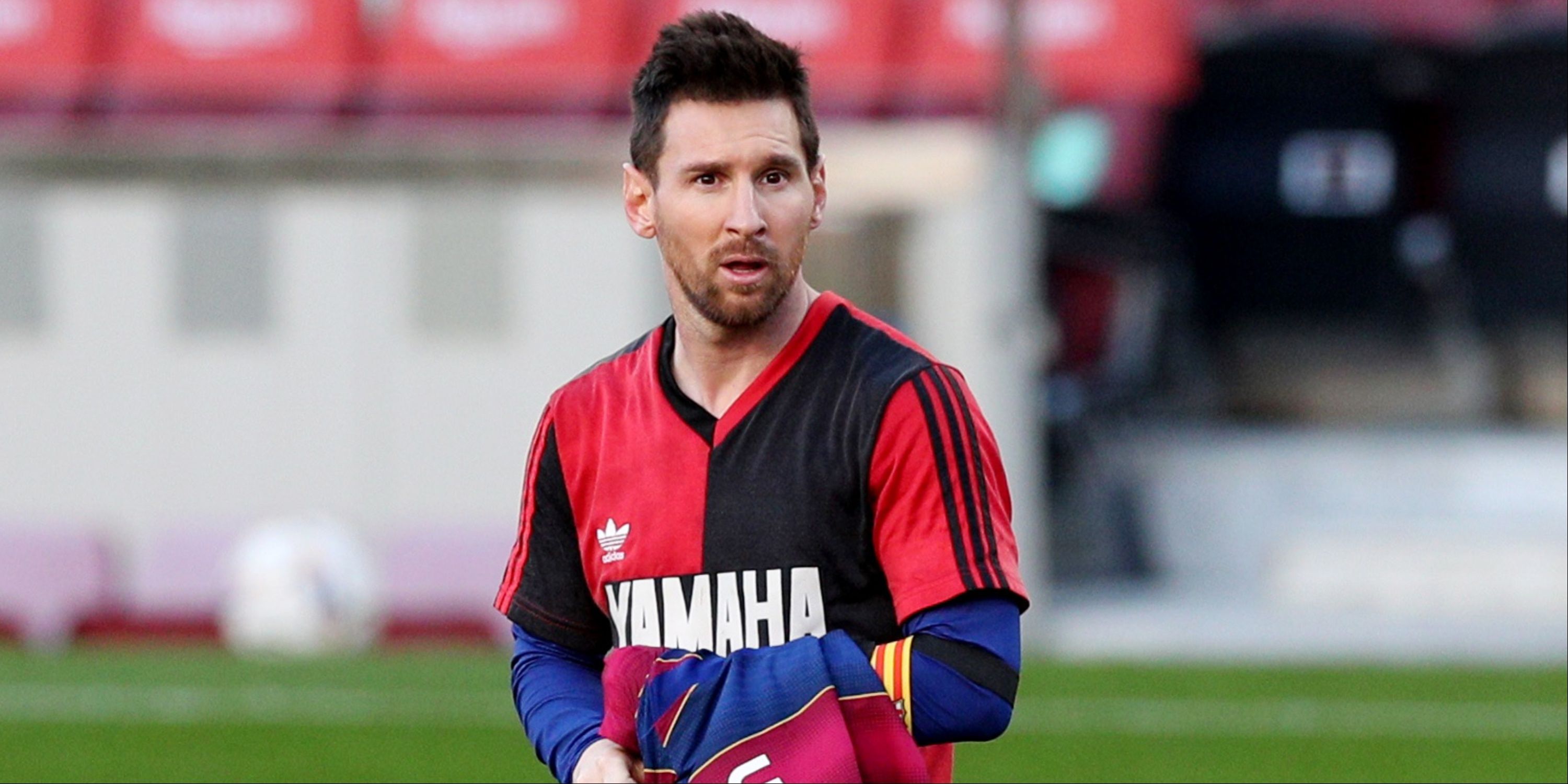 Lionel Messi wearing a Newell's Old Boys shirt