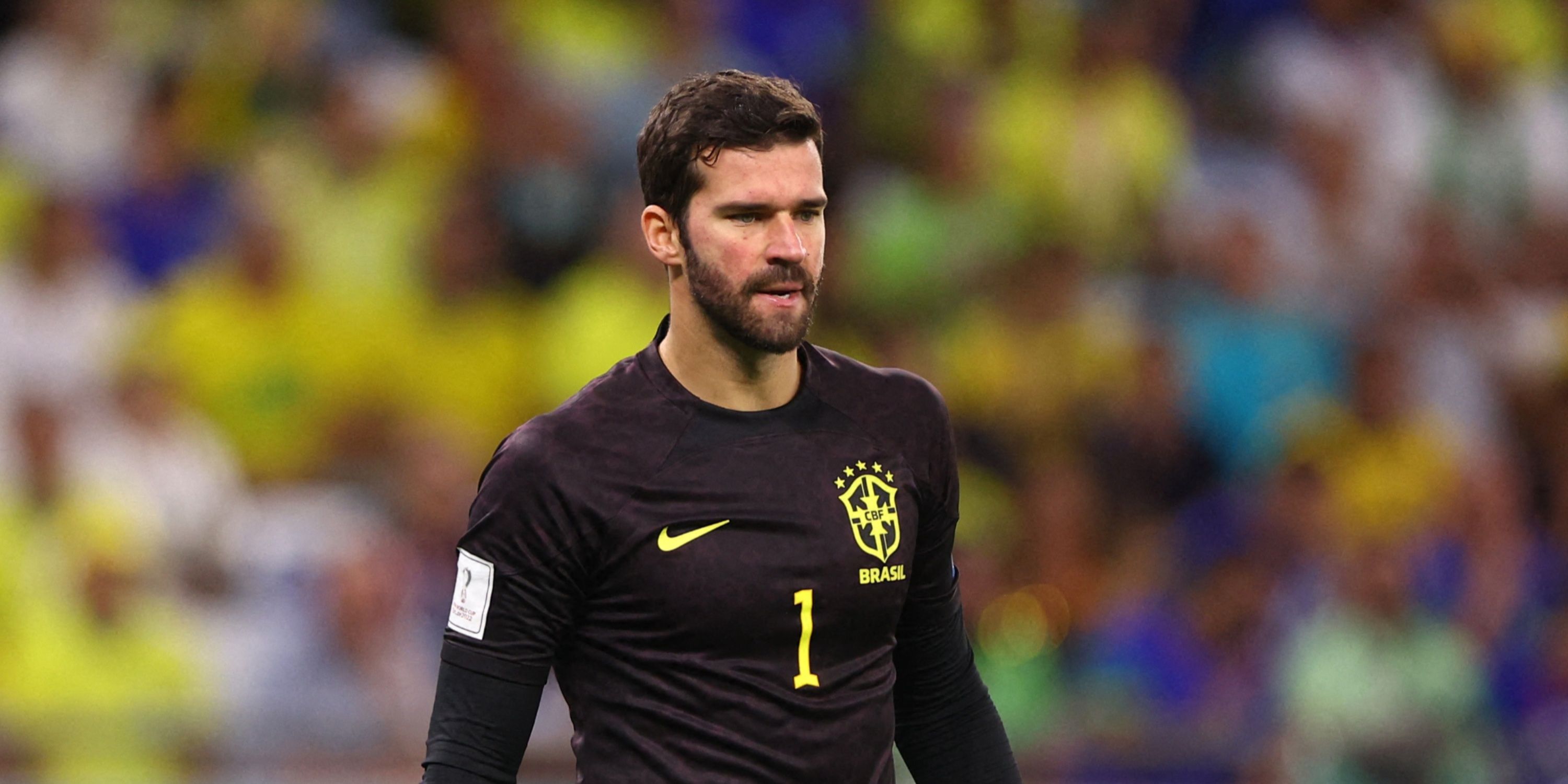 Alisson for Brazil reacts.