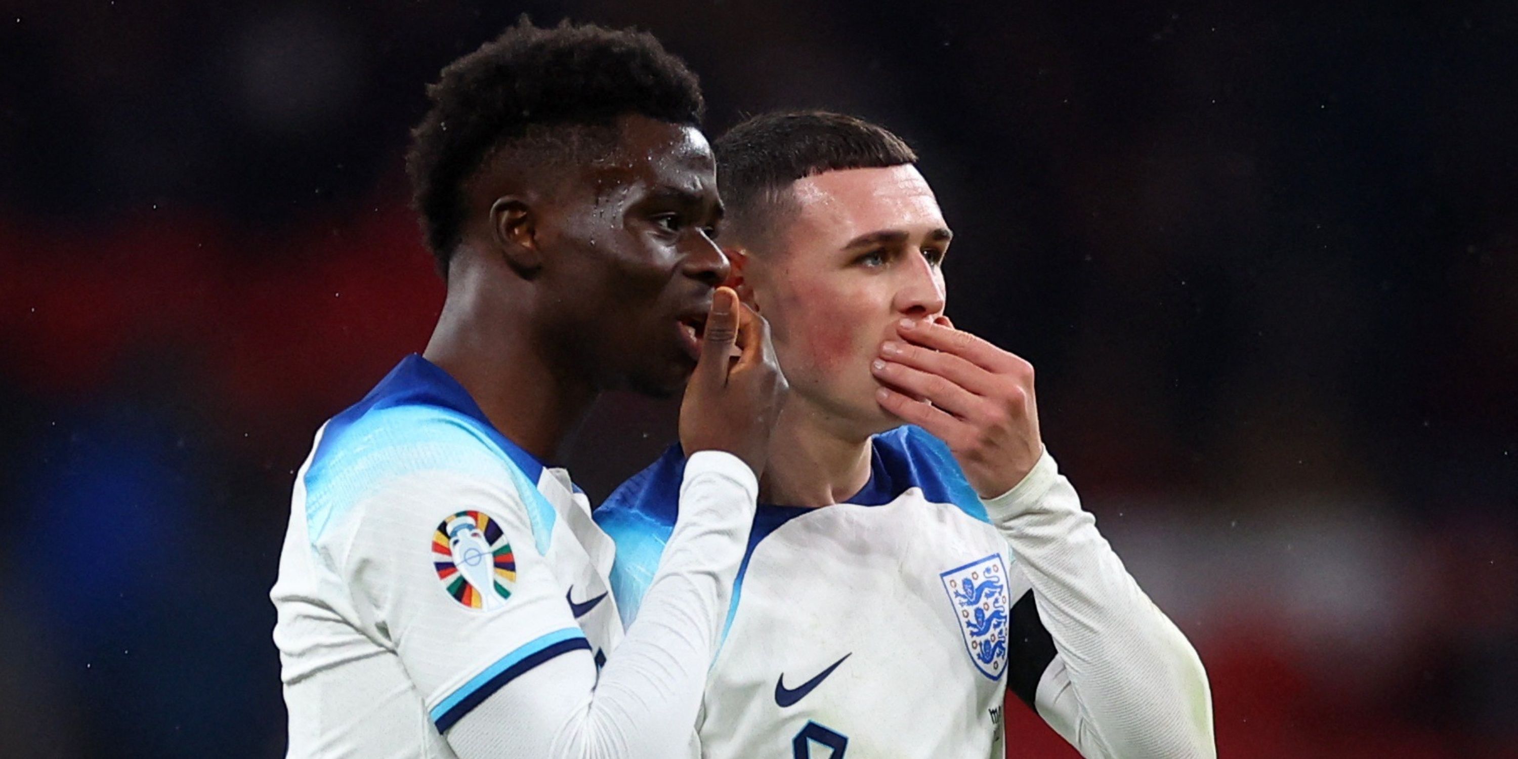 Bukayo Saka and Phil Foden in action for England