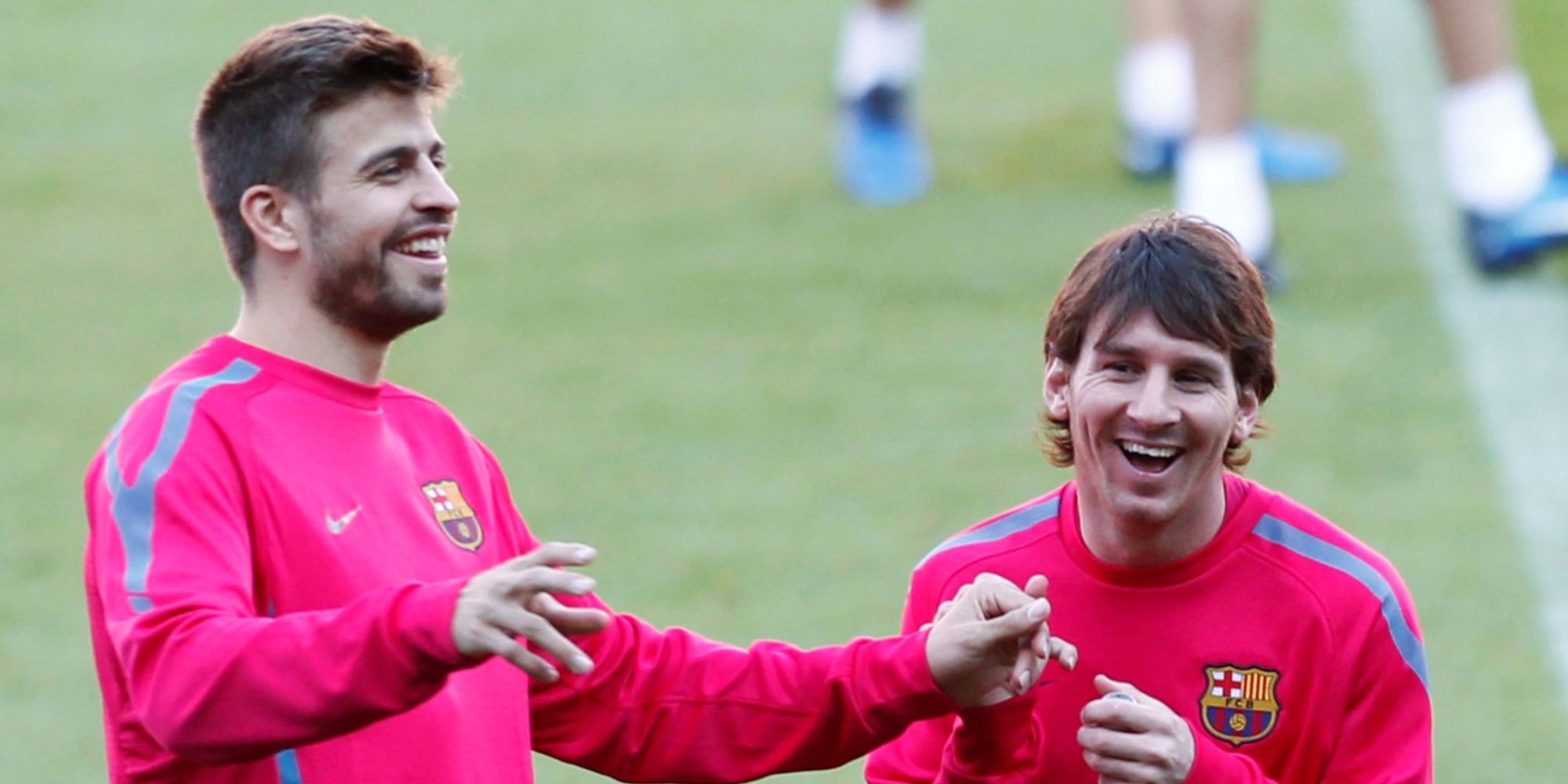 Gerard Pique and Lionel Messi in training